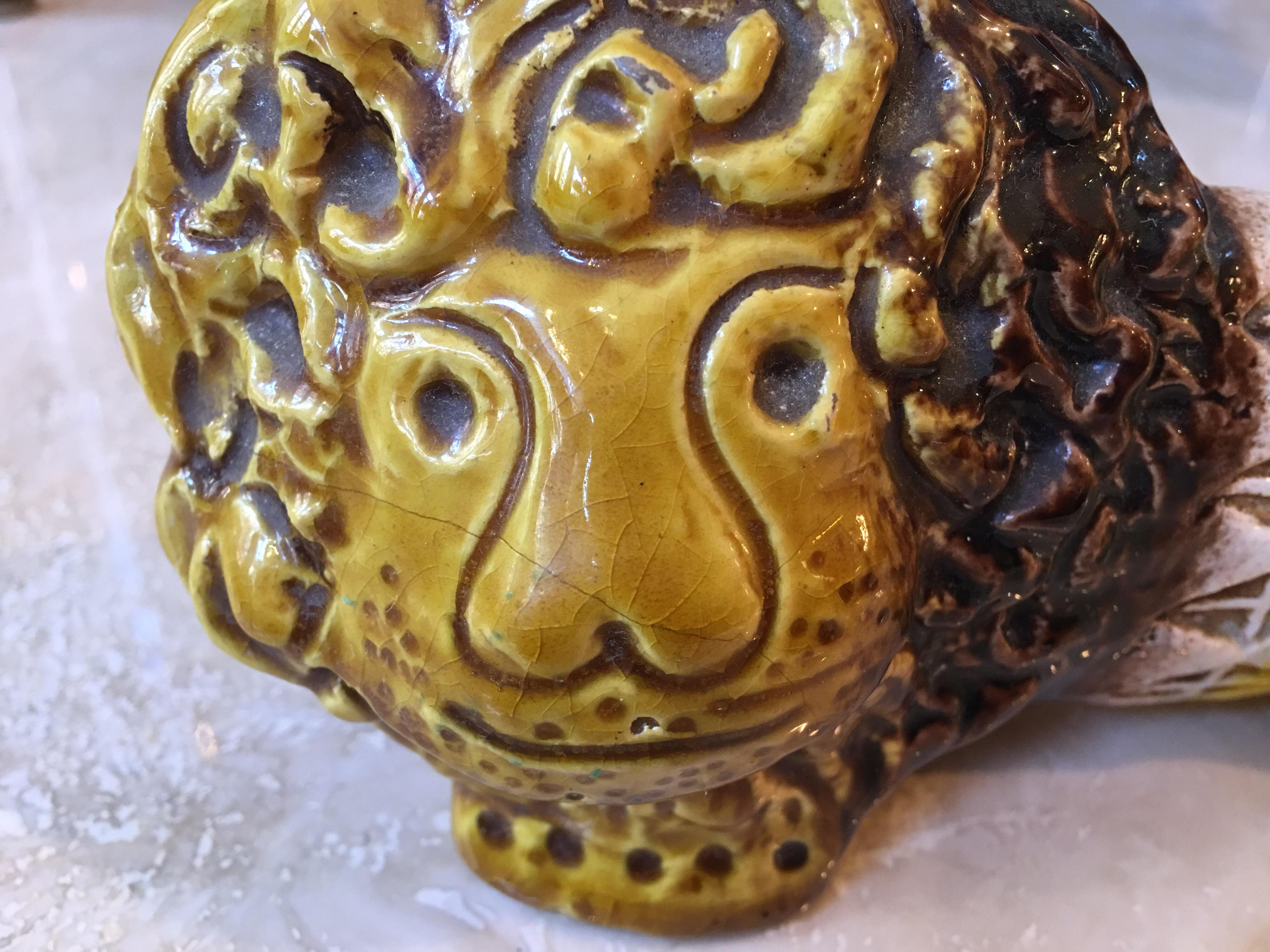 Aldo Londi for Bitossi ceramic lion in shades of yellow and browns. Little more uncommon color pallet than the more often seen blue. Glaze shows some crazing and one spot on top of tail where it might of touched the kiln wall. Overall presents very