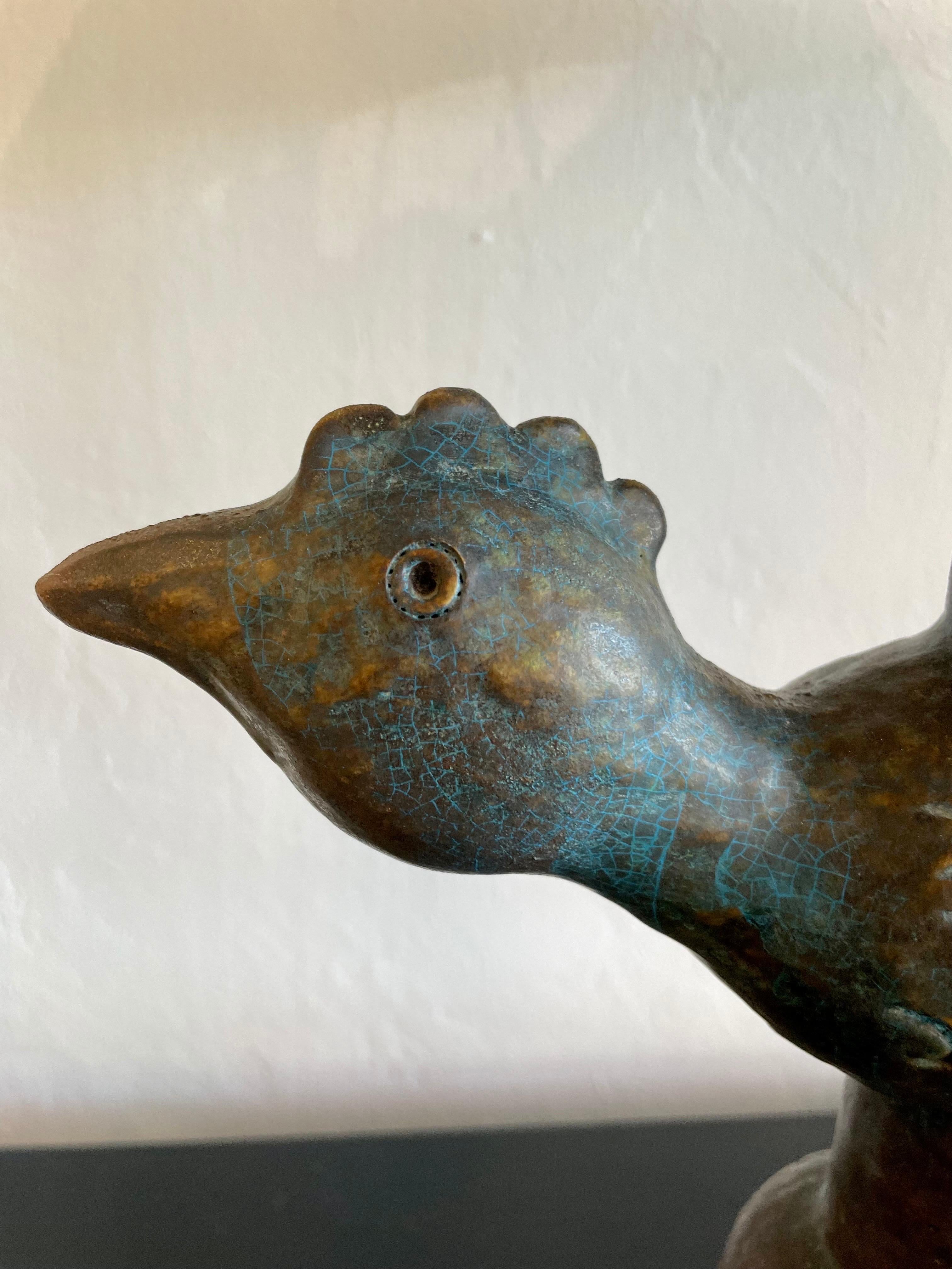 Finished in the most wonderful Etruscan glaze, this ceramic lamp depicting a rooster has touches of blues, greens, yellows, under the overlayer. Wired and working. note: shade shown not included.