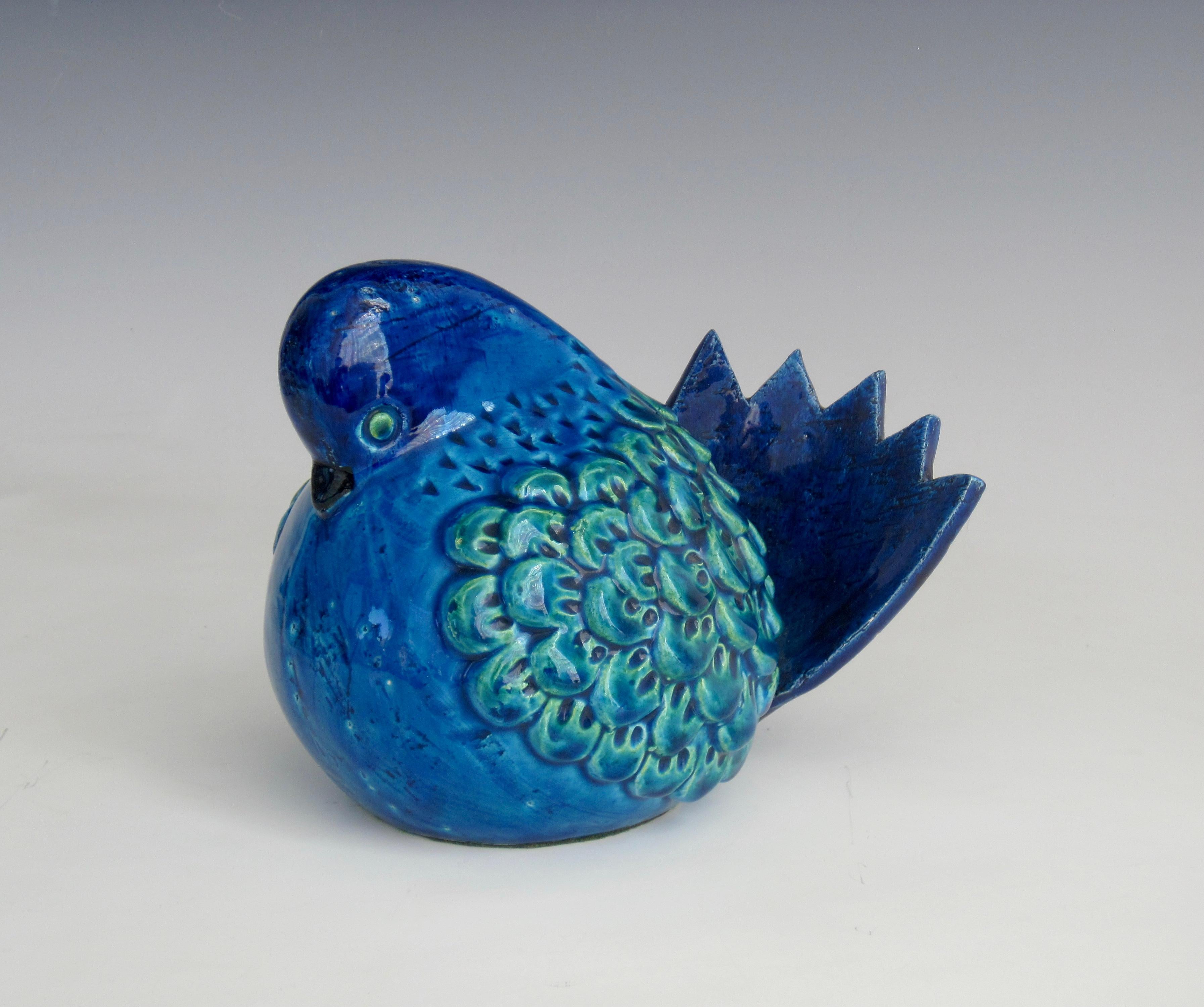 A hand crafted Aldo Londi (1911–2003) for Bitossi Ceramiche bird sculpture in Rimini Blue. The striking blue color and unusual use of texture make this series a hallmark for Bitossi and highly collectible. Bitossi Ceramiche recently turned 100 and