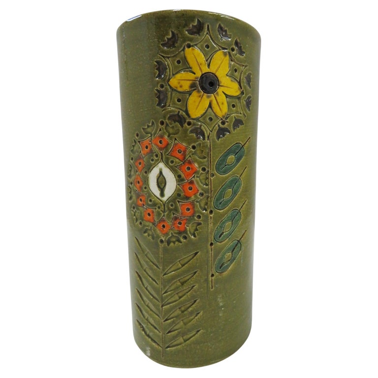 REDUCED FROM $350...Mid century Italian modern tall cylindrical vase by Aldo Londi for Bitossi probably retailed by Rosenthal Netter. Decorated with incised stylized flowers on a olive green glossy glaze. In perfect order, no issues.

Measurements: