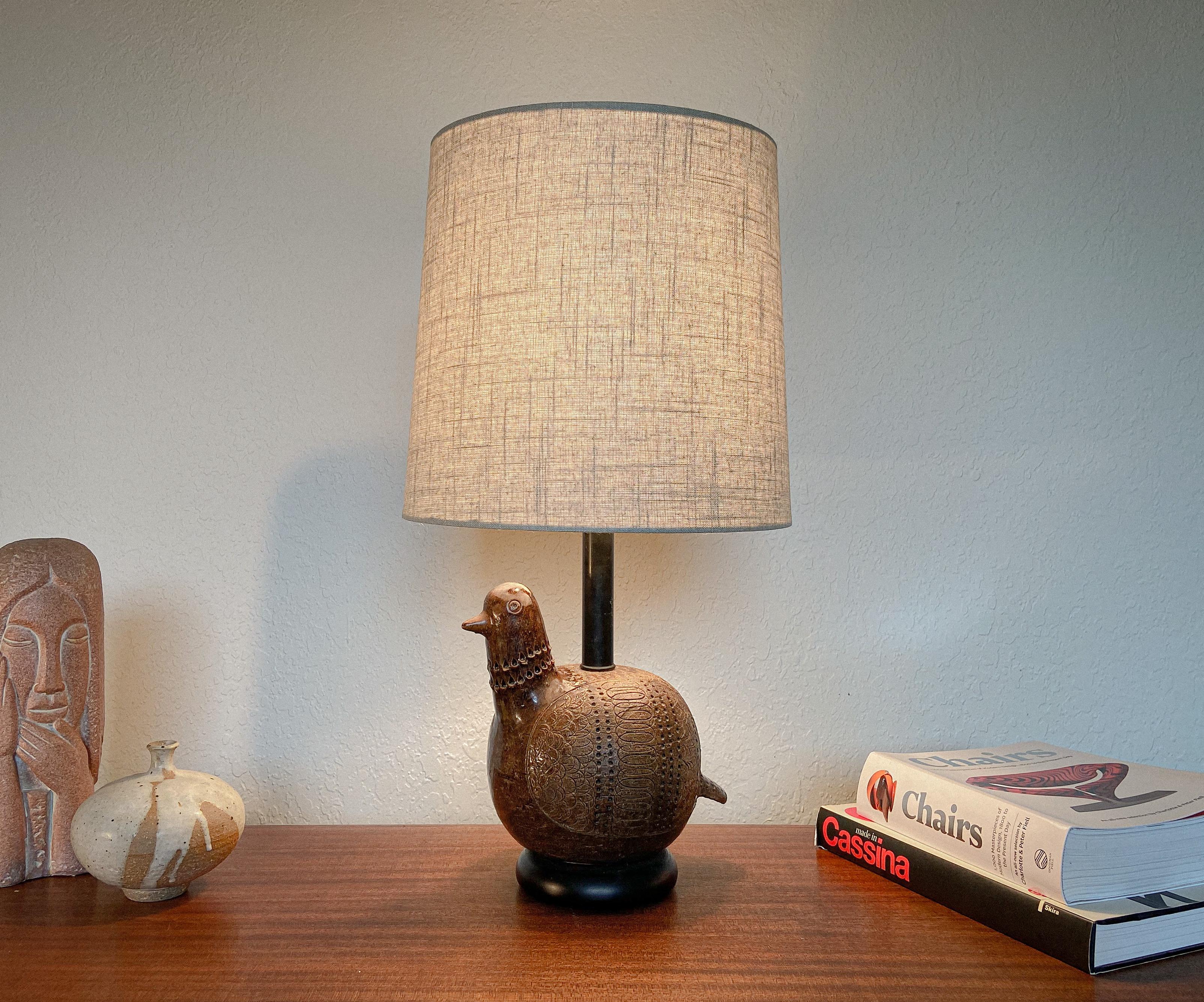 A fun and unique table lamp designed by Aldo Londi for Bitossi. Featuring a hand made, hand glazed ceramic body in the form a partridge.

A versatile lamp that will work well in a variety of settings. Fully rewired and ready to use. Shipping price