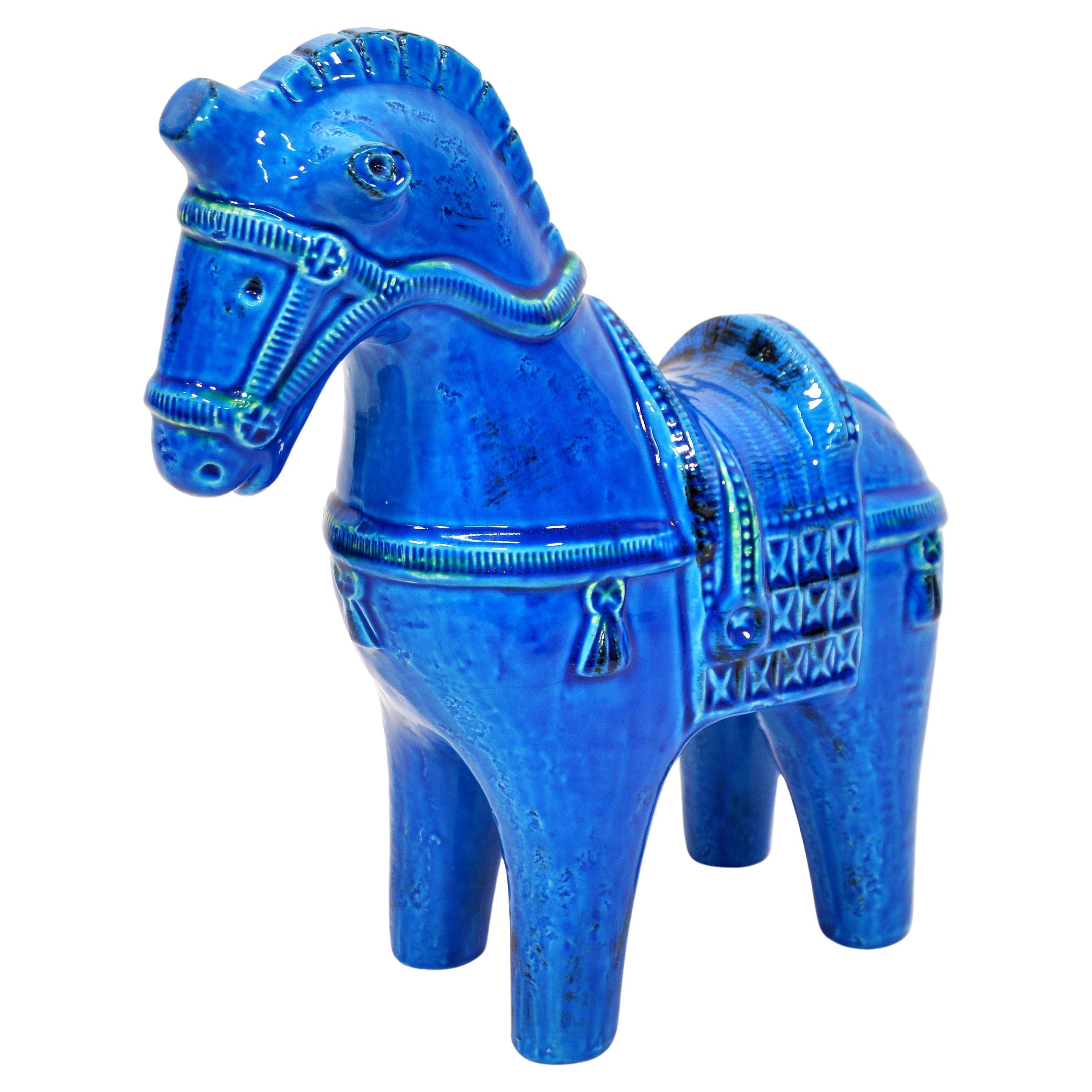 Tall Italian handmade ceramic horse sculpture in the vibrant signature blue of Aldo Londi's iconic art pottery collection Rimini Blu, originally designed in 1959 for Bitossi Ceramiche and imported by Raymor in the 1960s. The deep blue glaze varies