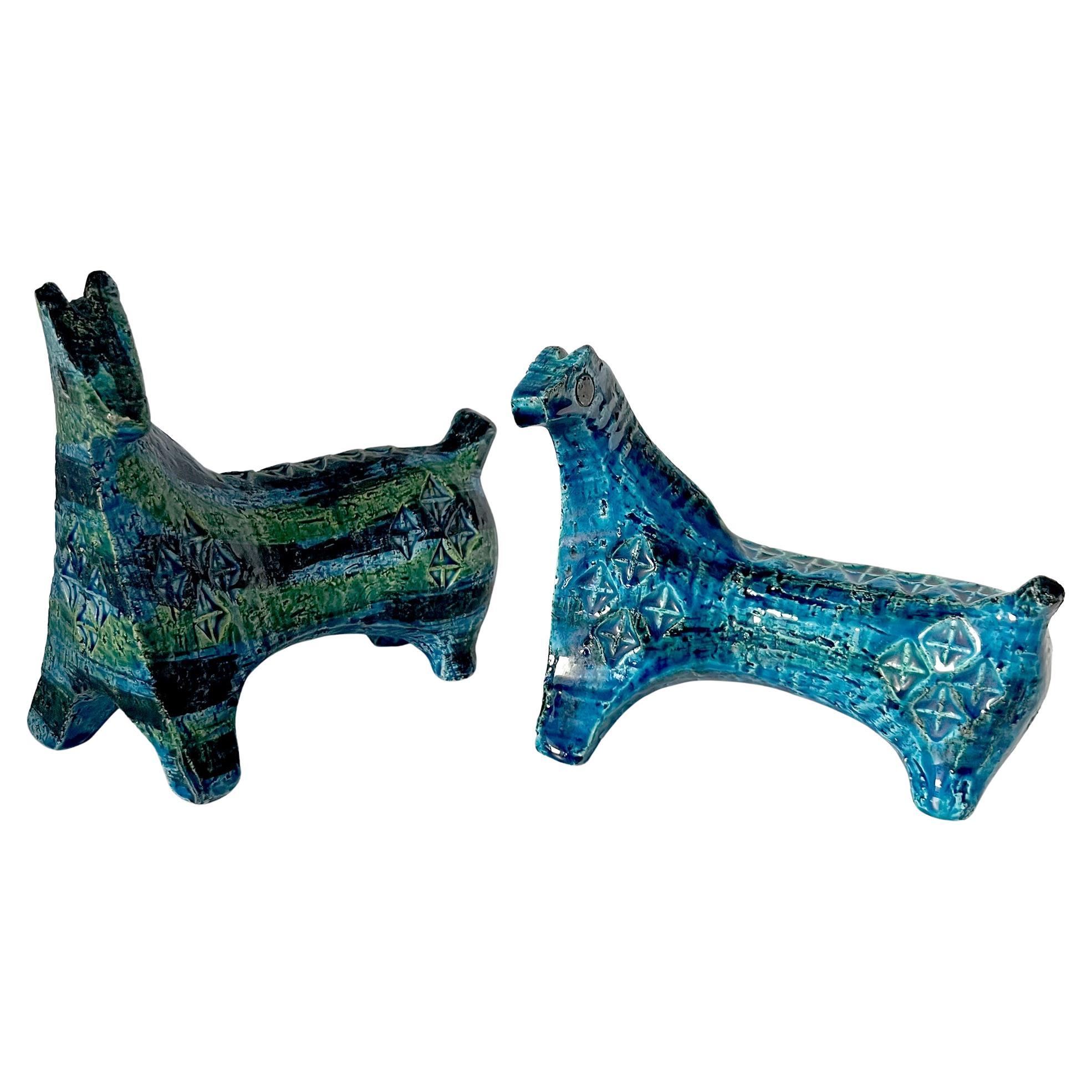 Pair of horse sculptures created by Aldo Londi for Bitossi of Italy.  each has great coloration of blue and green glazes within the stamped texture. Large horse measures 6