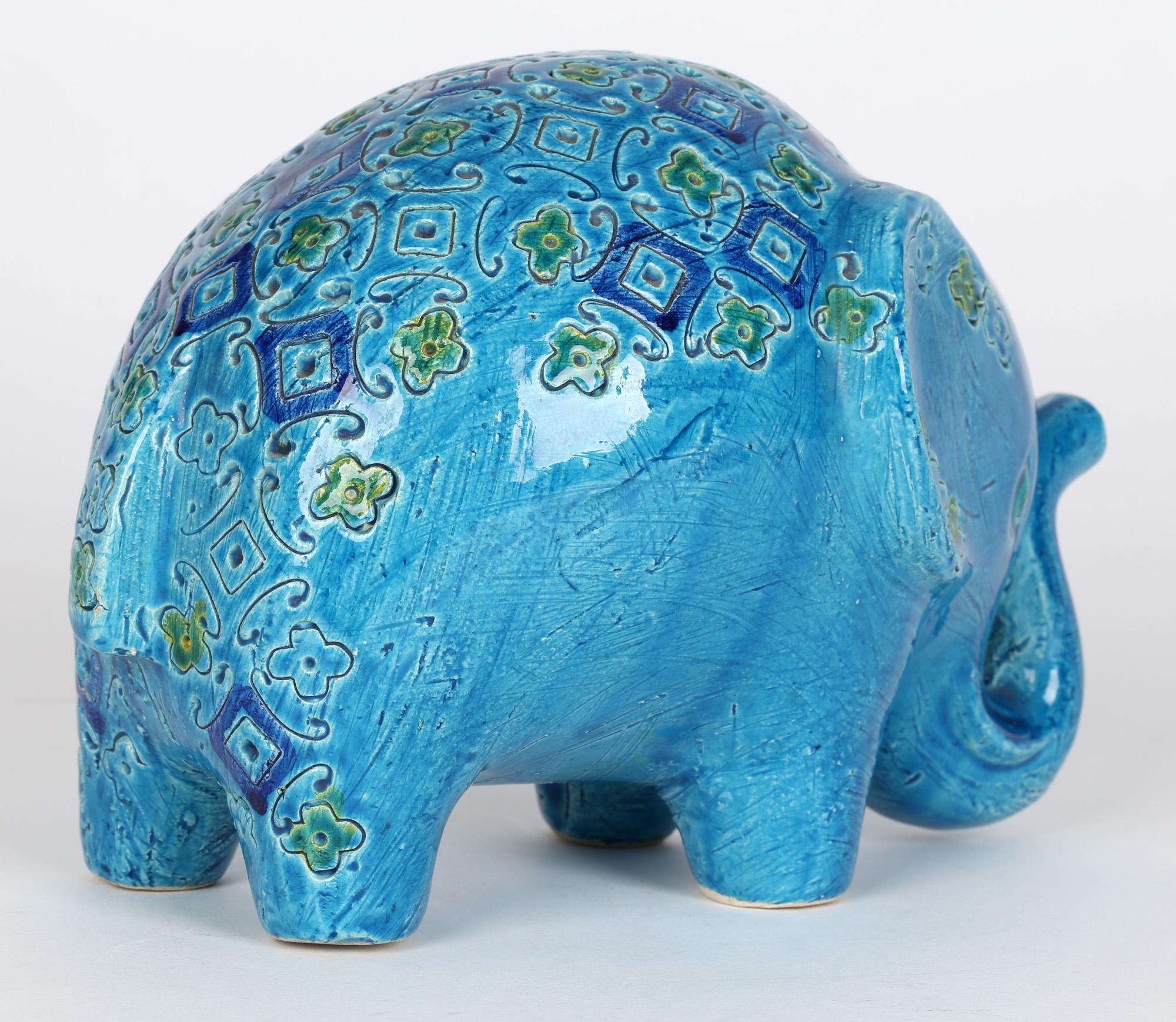 A stylish vintage Italian Bitossi Rimini Blu stylized pottery figure of an elephant designed by Aldo Londi and dating to the 1950's. This stylish hollow made standing figure is modeled in slightly abstract form and decorated in turquoise blue glazes