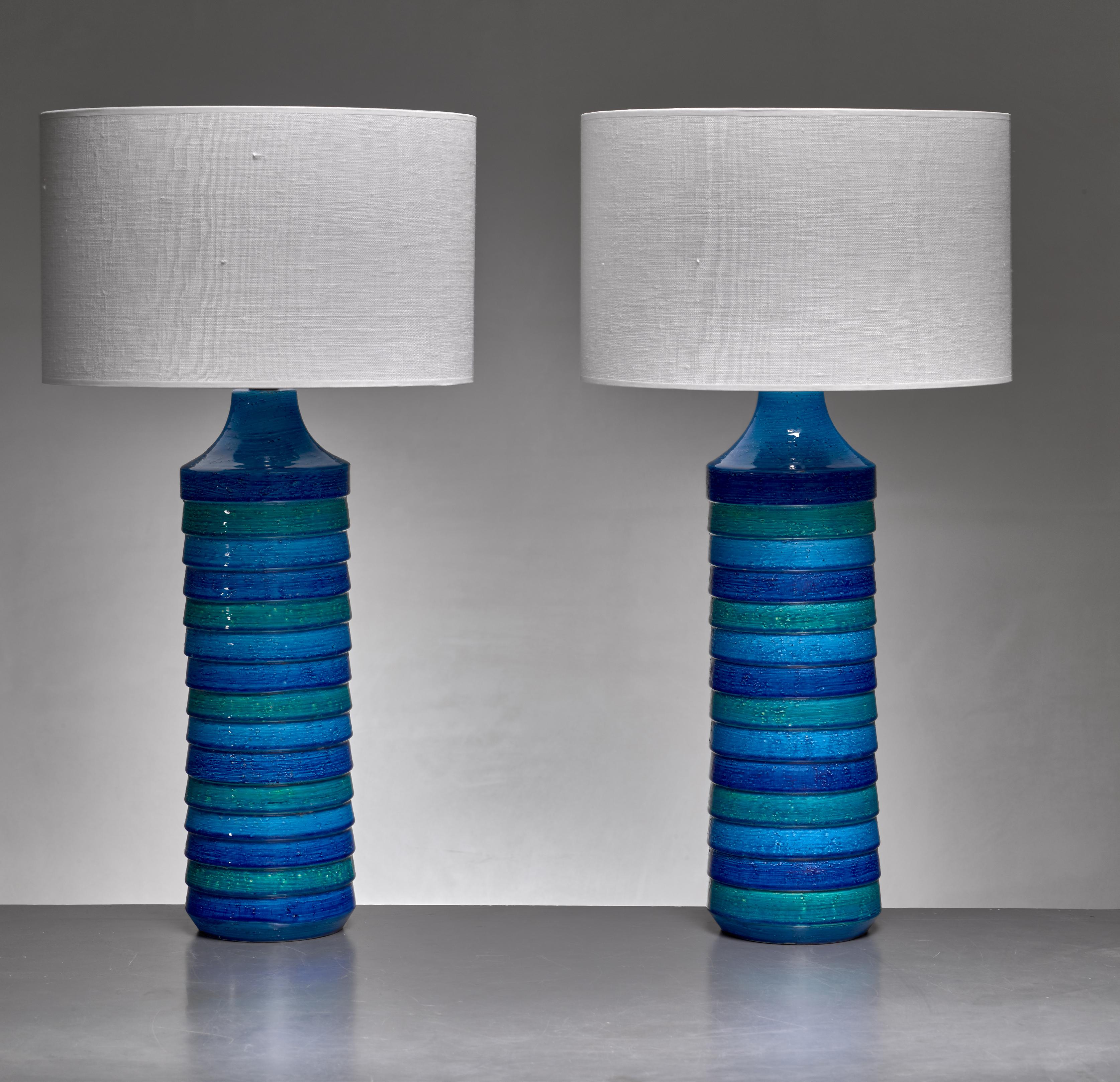 A pair of large Italian floor or table lamps by Aldo Londi for Bitossi.

The lamps are made of ceramic with a blue and green striped glazing.
