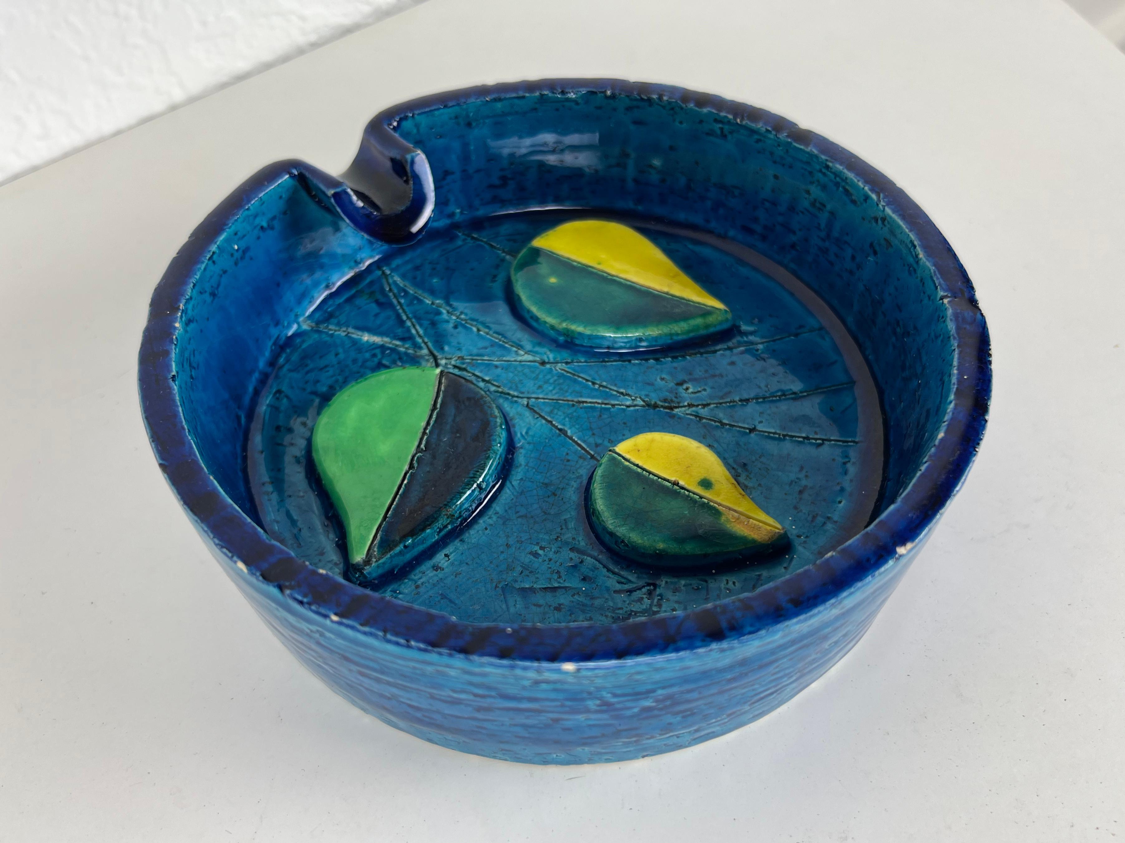 Vintage ashtray in signature Rimini blue glaze with leaf motif by Aldo Londi for Bitossi. Marked 