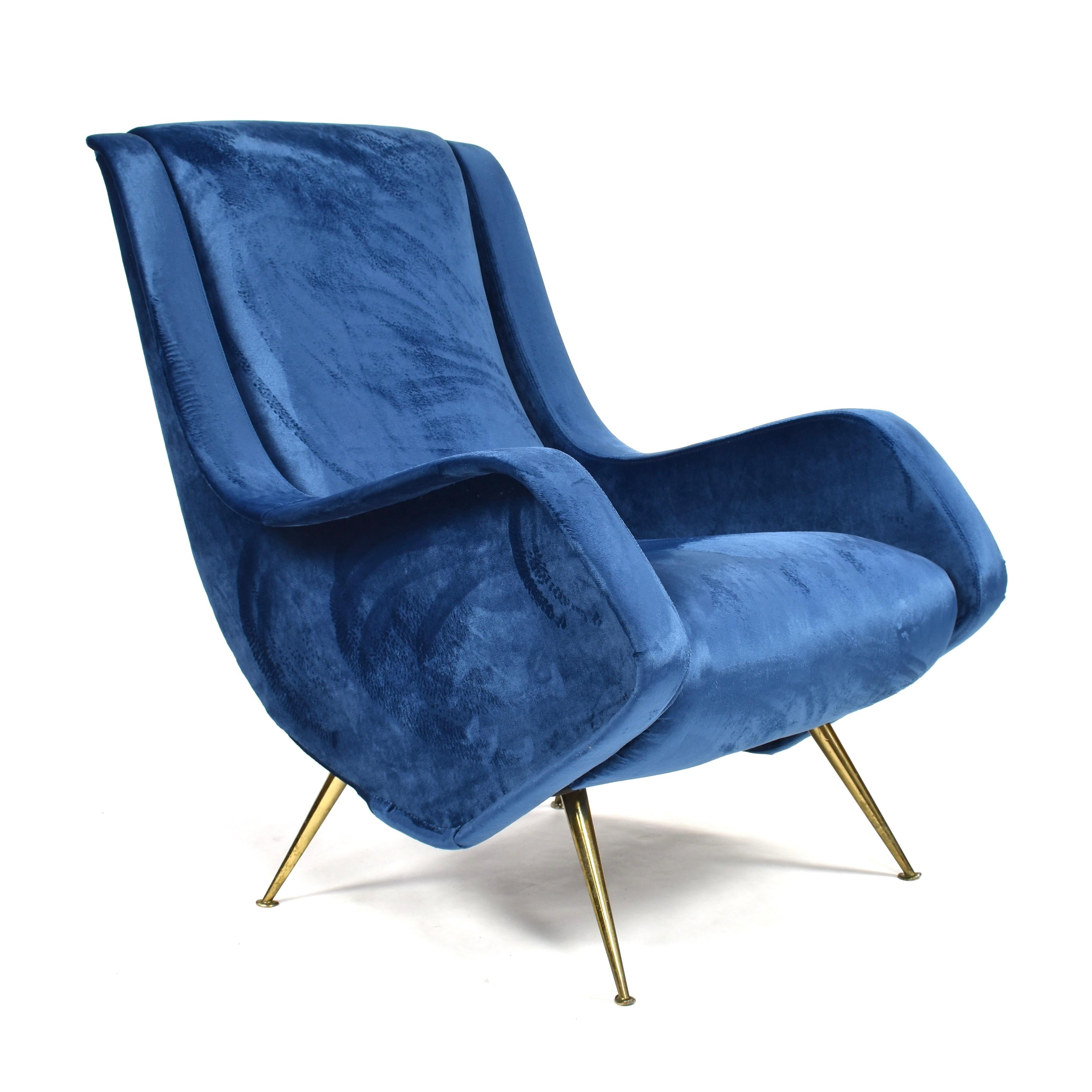 Beautiful Italian lounge armchair by Aldo Morbelli for ISA Bergamo. The chair has been reupholstered in a beautiful Royal Blue velvet fabric. The chair features brass legs.

Designer: Aldo Morbelli

Manufacturer: ISA Bergamo

Country: