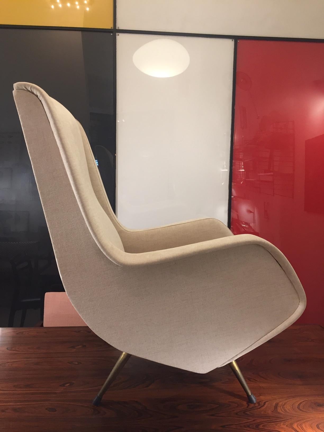 A midcentury Italian pair of armchairs designed by Aldo Morbelli in the 1950s. Reupholstered in Kvadrat light beige fabric. Brass feet. Smart and elegant. Impeccable.