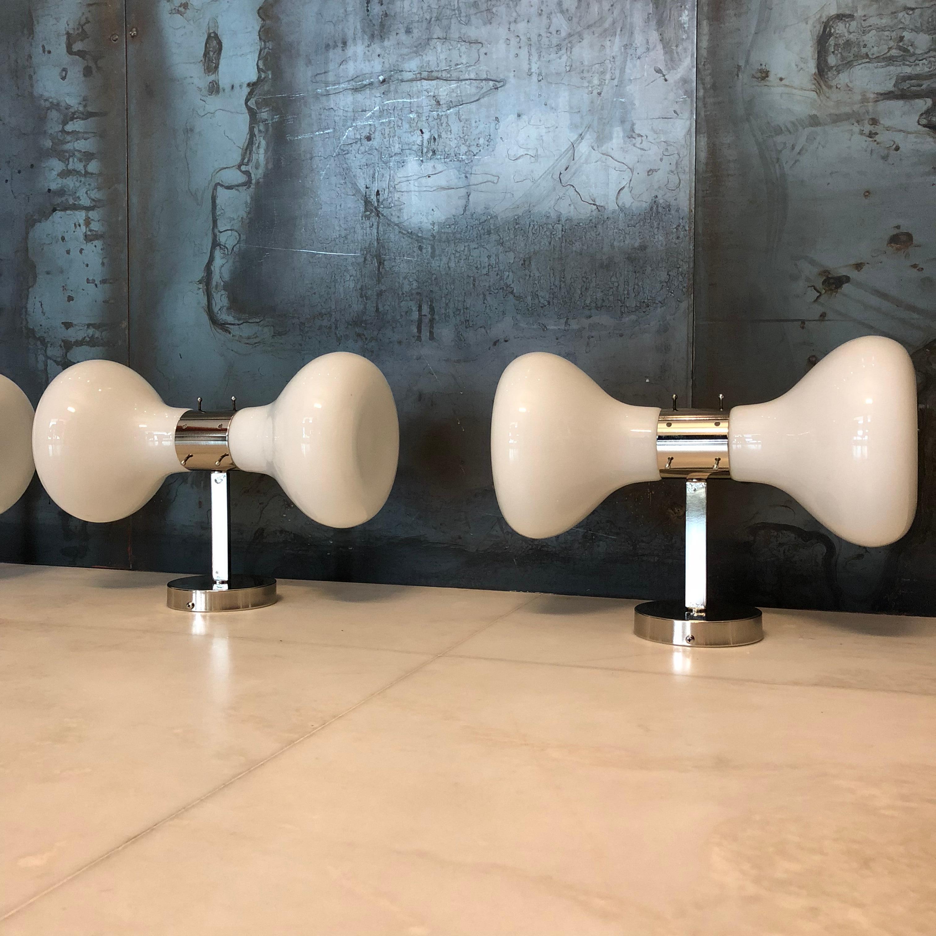 Set of five sconces designed by Aldo Nason and produced by Mazzega in the 1970s. Features nickelled brass frames and white Murano glass diffusers. Each sconce is fitted with two sockets for E14 bulbs.