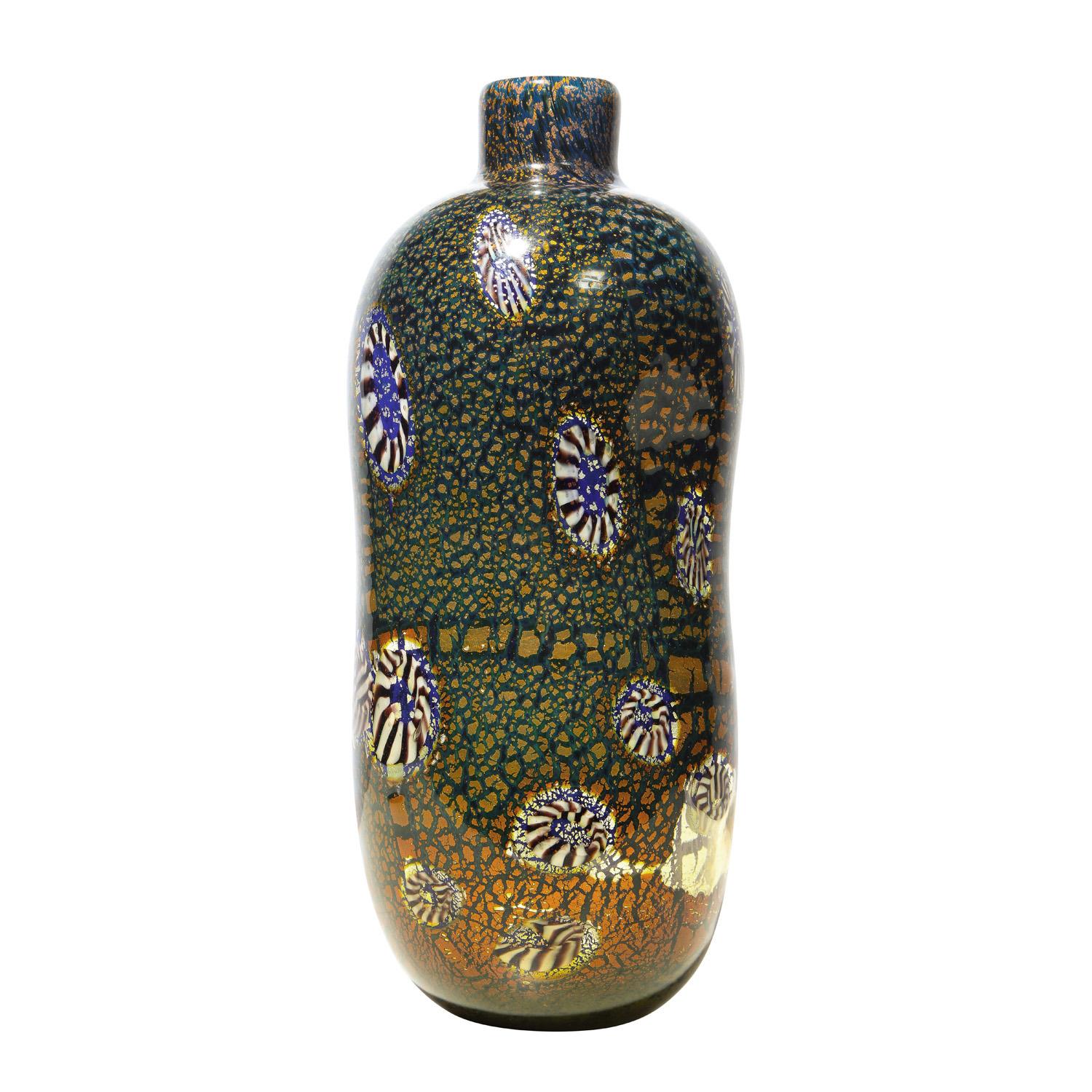 Hand-blown glass vase with undulating form from the Yokohama Series, blue glass with murrhines and gold foil, by Aldo Nason for Arte Vetraria Muranese (A.V.E.M.), Murano Italy, 1960's. Nason, who trained with Giulio Radi, took his design techniques