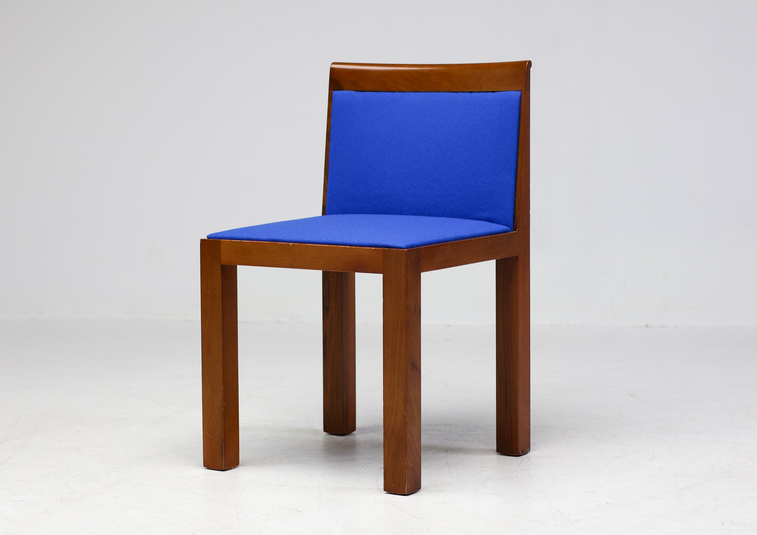 Exceptional Post-Modern Teatro side chairs designed by architect Aldo Rossi and Luca Meda and manufactured by Italian furniture company Molteni.  Beautiful timeless design in high quality solid cherry wood reupholstered in brand new Royal Blue