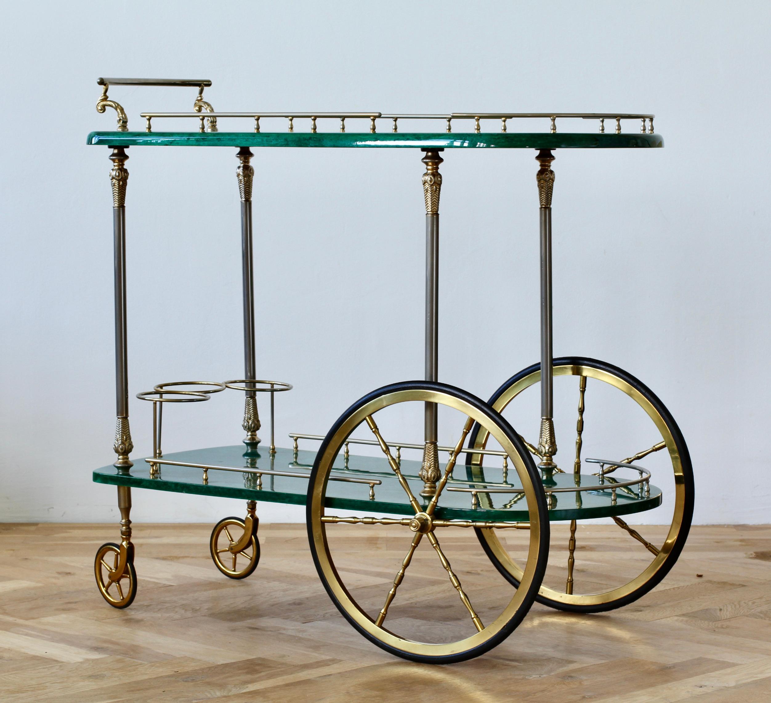 Large Italian 1950s bar cart, tea trolley or drinks stand by Aldo Tura, Milan. Stunning green colored (coloured) and lacquered goatskin leather combined with gilded cast metal handles, rails and finals.

Original 'Tura Milano' label is present on