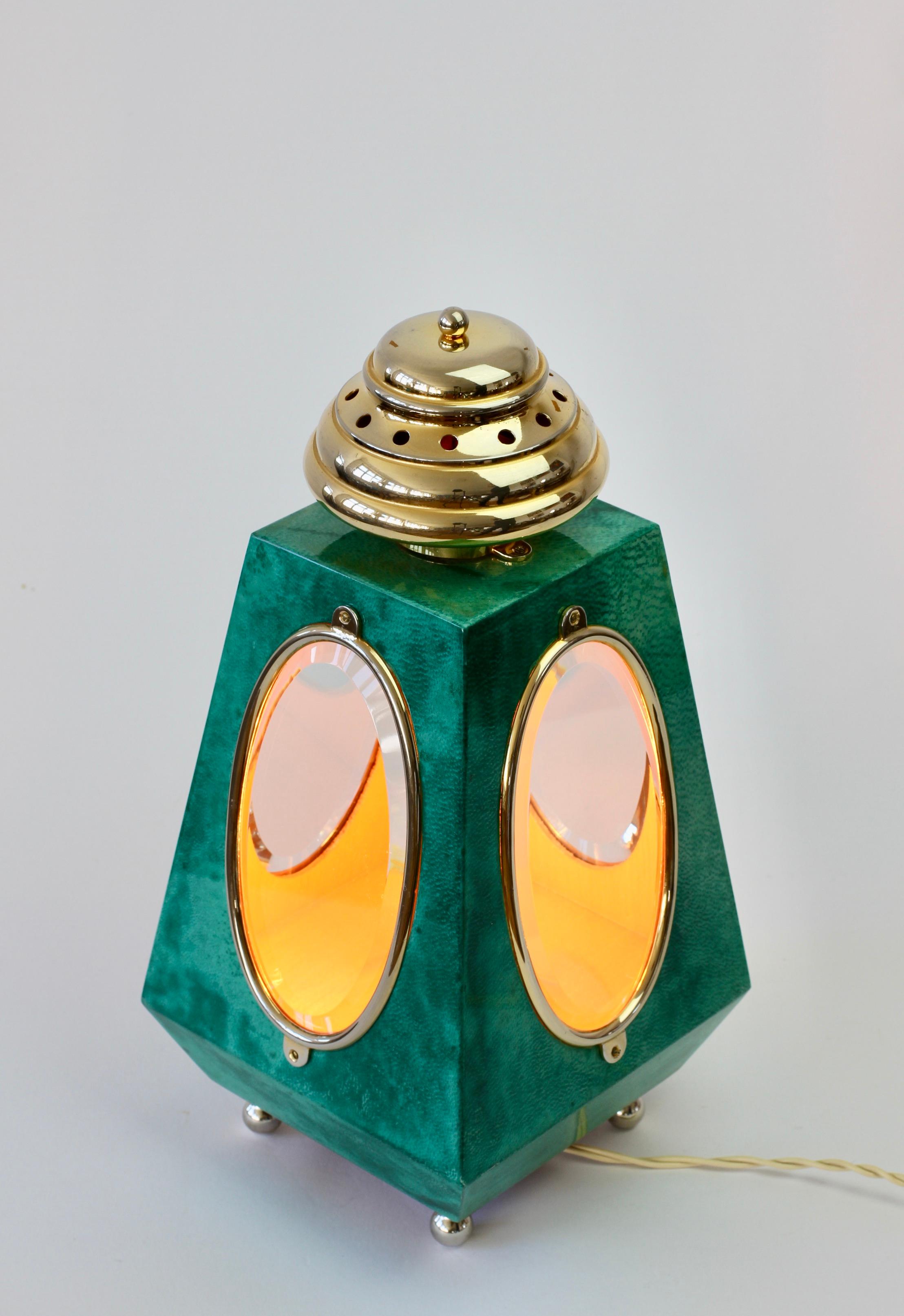 Midcentury Italian 1960s vintage lantern style table lamp attributed to Aldo Tura, Milan. The green colored and lacquered goatskin leather combined with gilded cast metal details is perfect for any midcentury or Hollywood Regency collector of