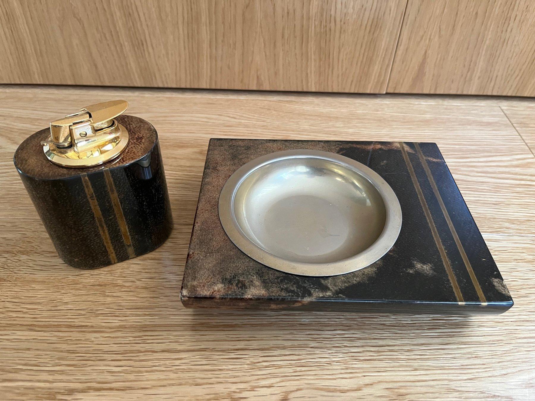 Indulge in the sophistication of this Aldo Tura ashtray lighter, an Italian masterpiece in parchment. Tura, celebrated for his luxurious designs, crafted this object with meticulous attention to detail, using exotic finishes like eggshells,