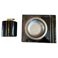 Aldo Tura ashtray and lighter in goatskin veneer with brass elements
