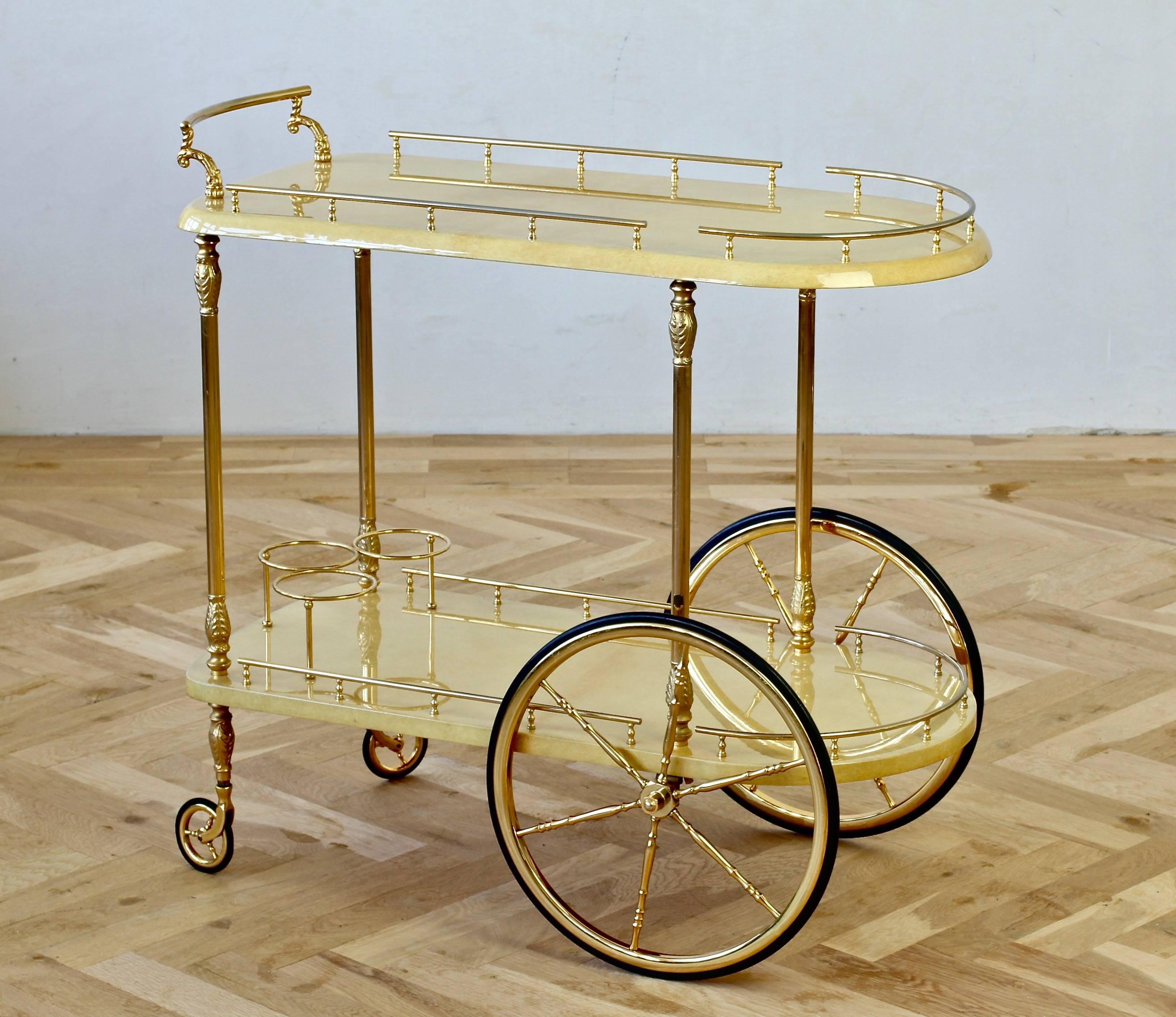 Large Italian 1950s bar cart, tea trolley or drinks stand attributed to Aldo Tura, Milan. Looking at the construction of this piece we have attributed this to Aldo Tura as the quality of the piece has all the hallmark of his work - the cream colored