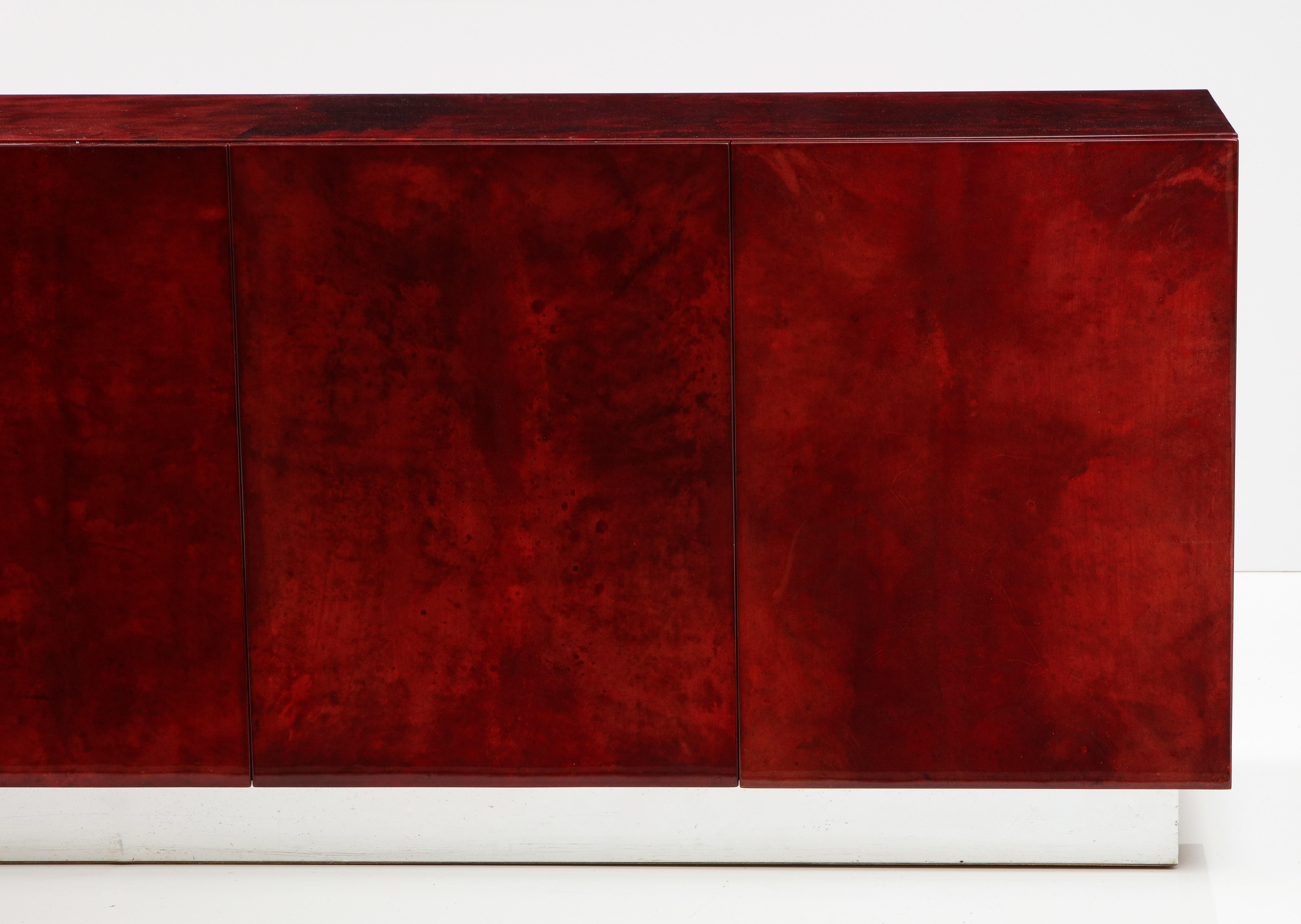 Aldo Tura Blood Red Goatskin Cabinet, Chrome Plinth Base, Italy, 1960 In Good Condition For Sale In Brooklyn, NY