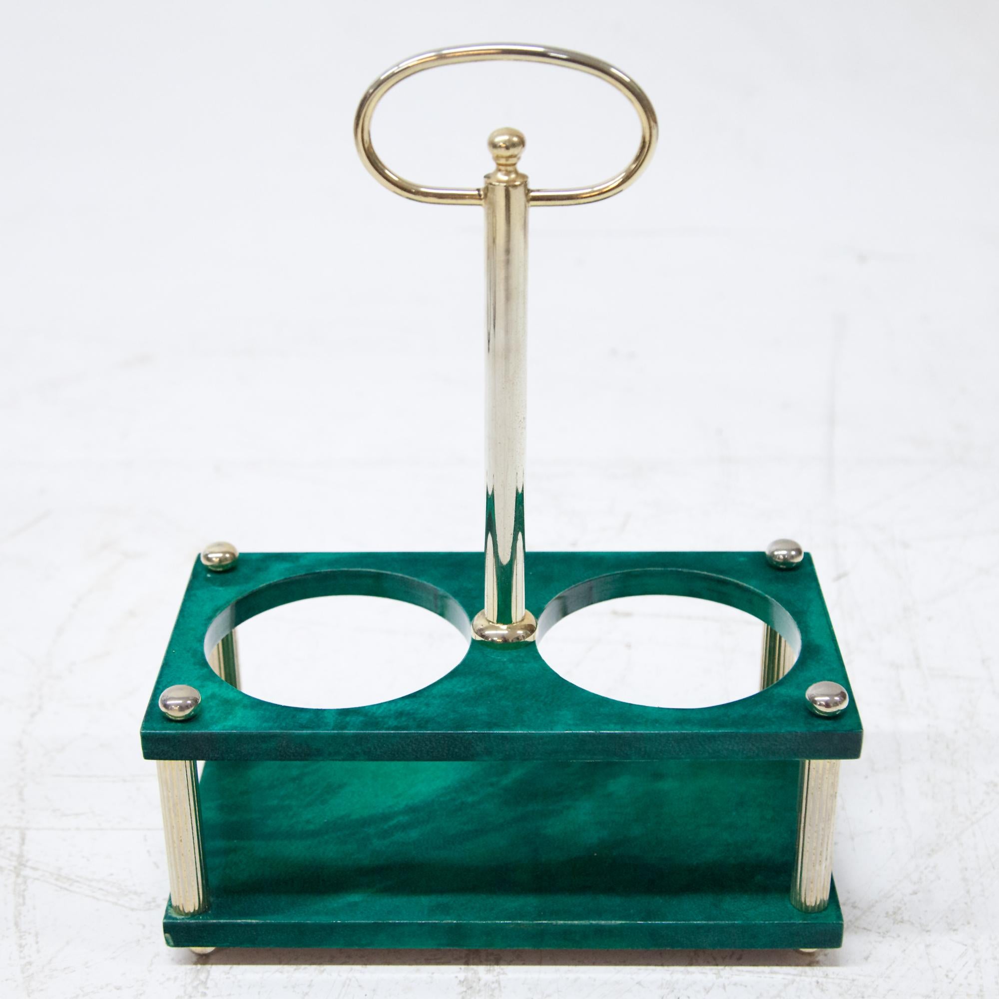 Bottle holder covered with green colored goatskin and clear varnish. Space for two bottles. Brass-plated. Bottom label 
