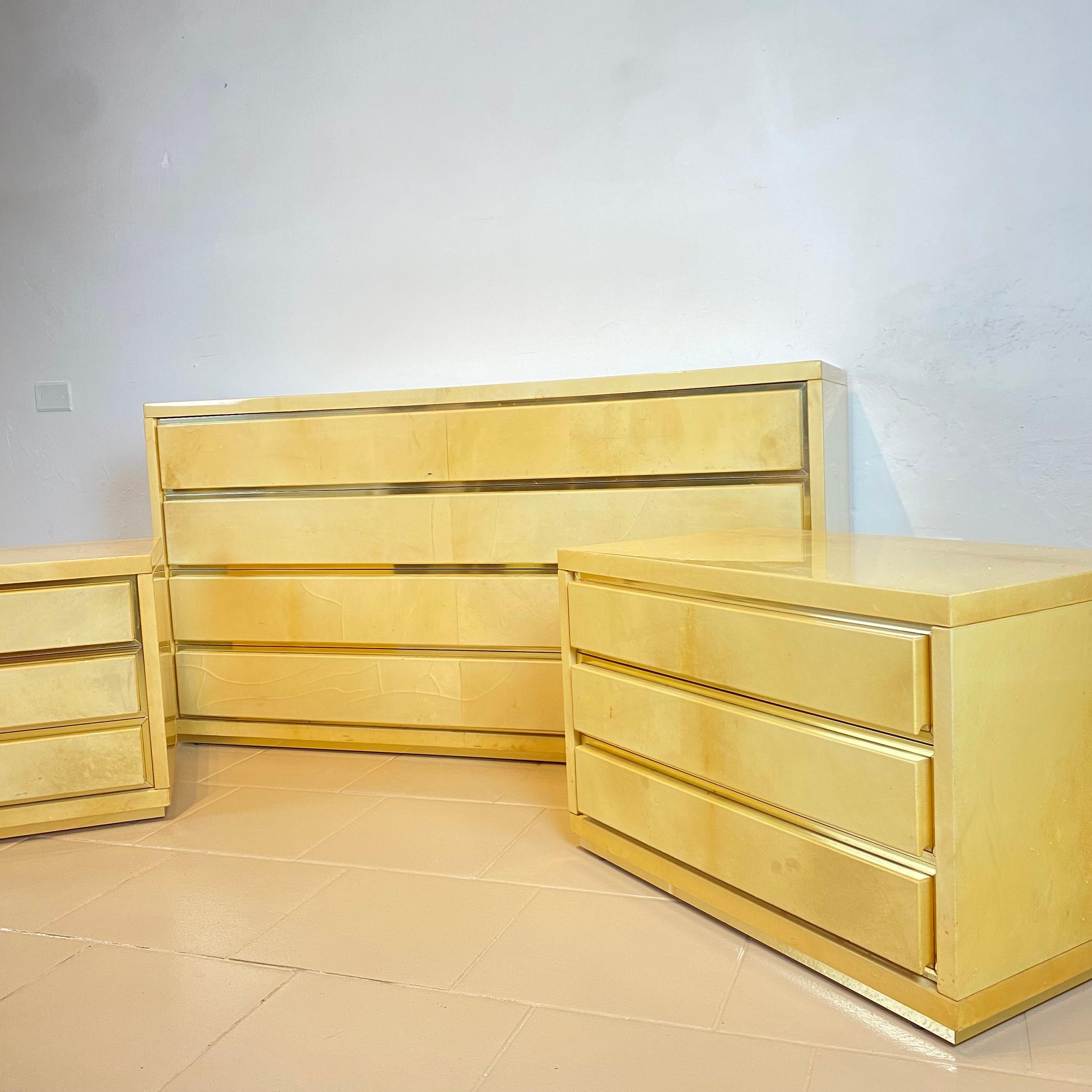 Italian Aldo Tura Chest of Drawers and a Pair of Nightstands in Parchment and Brass