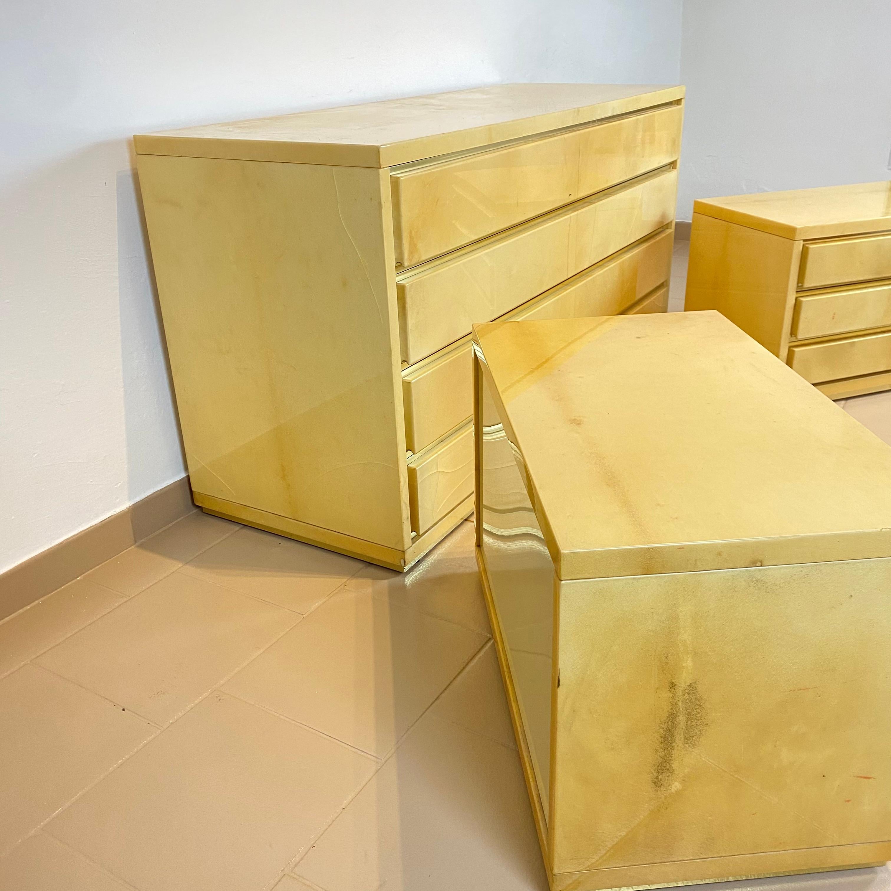 Aldo Tura Chest of Drawers and a Pair of Nightstands in Parchment and Brass In Distressed Condition In Conversano, IT