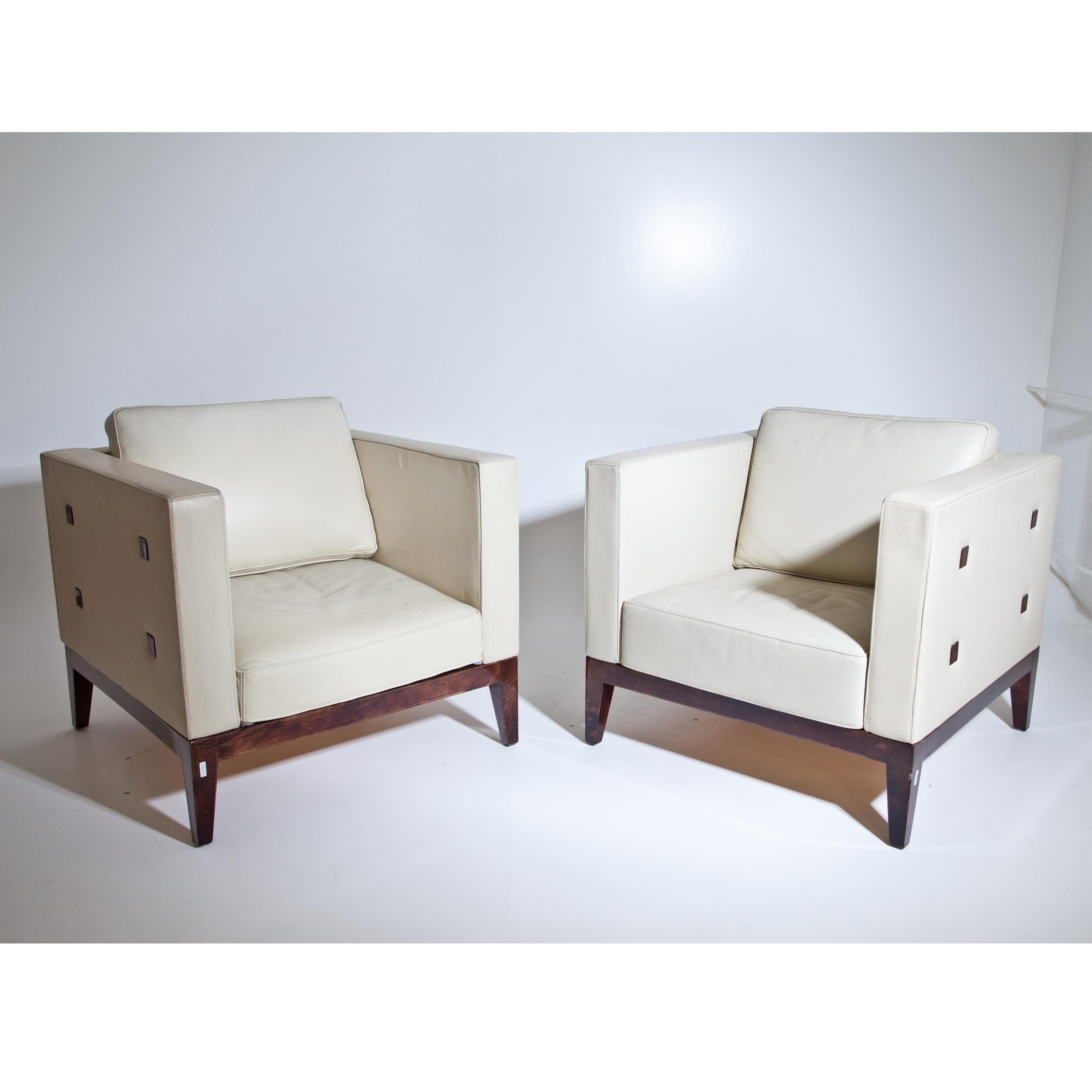 Pair of Aldo Tura Cubo lounge chairs on square legs with straight frame and beige leather upholstery. The frame is covered with brown goatskin and clear lacquer.
