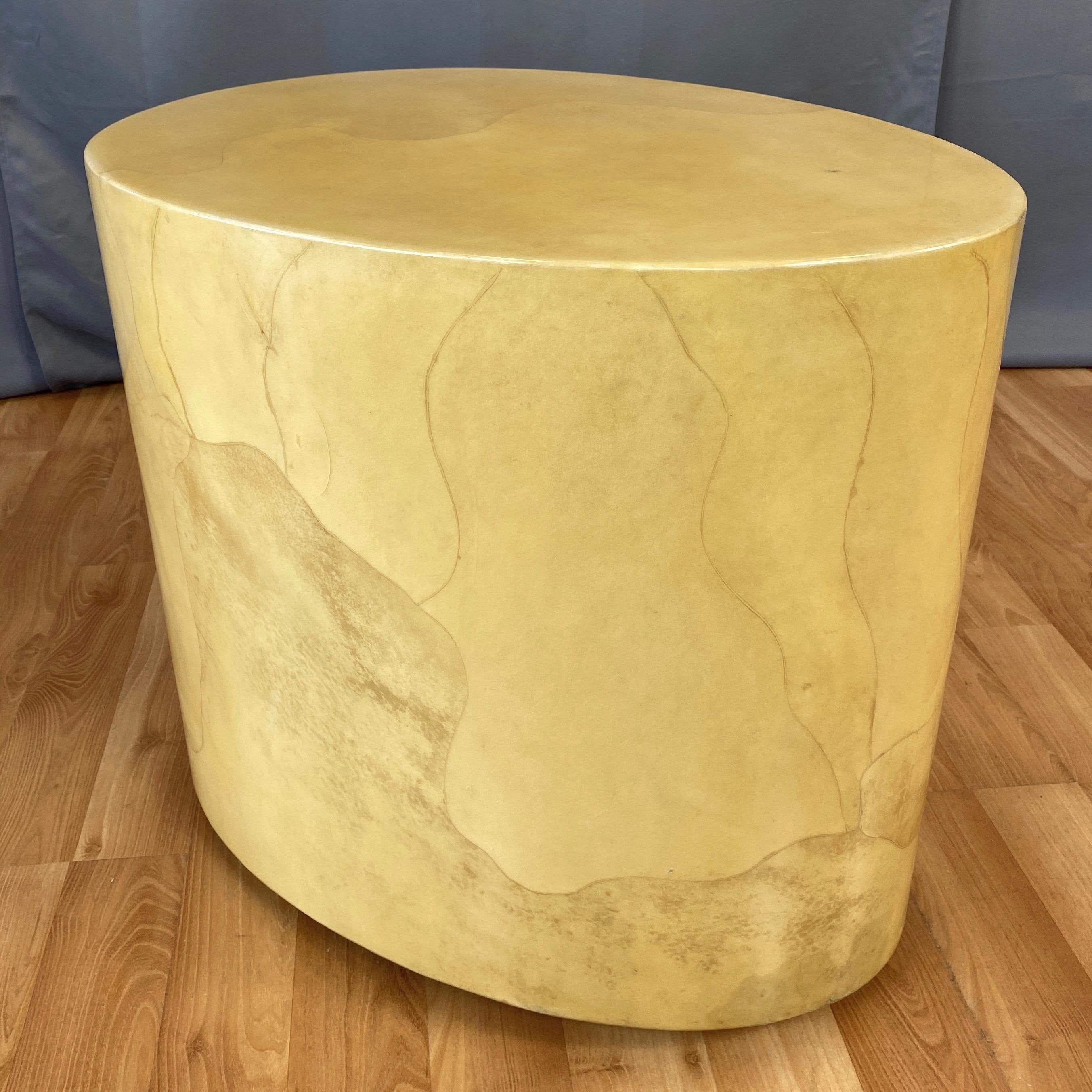 A rare late 1960s sculptural egg-shaped side or cocktail table in lacquered goatskin by noted Italian designer Aldo Tura.

Clean, minimalist form with a striking and substantial polished stone-like presence. Completely clad in meticulously fitted