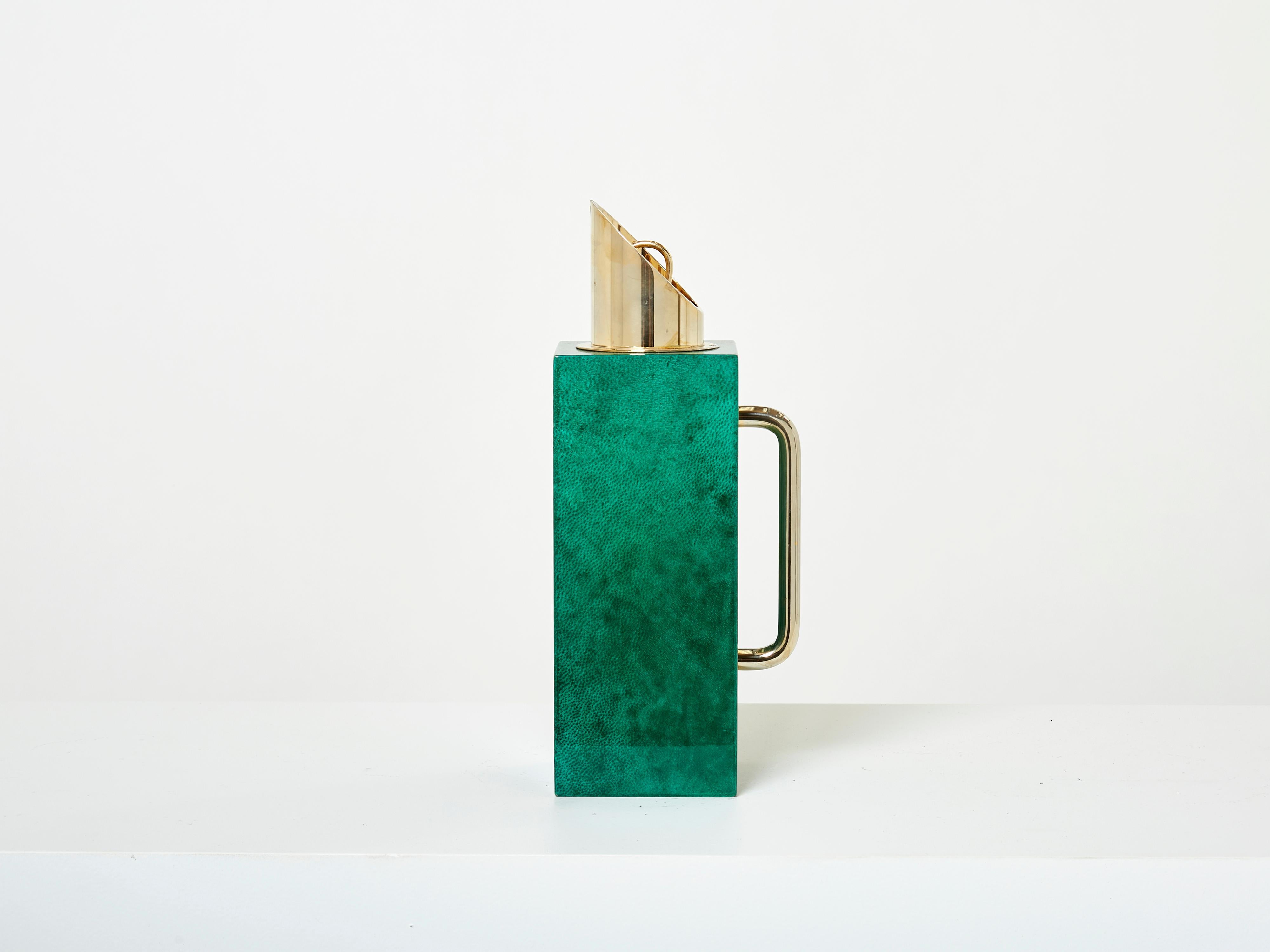 This is a beautiful thermos or carafe or pitcher designed by Aldo Tura in the early 1960s. This carafe is covered by goatskin parchment, in rich shades of emerald green, with brass and gilt metal details, typical of Aldo Tura’s work. This pitcher is