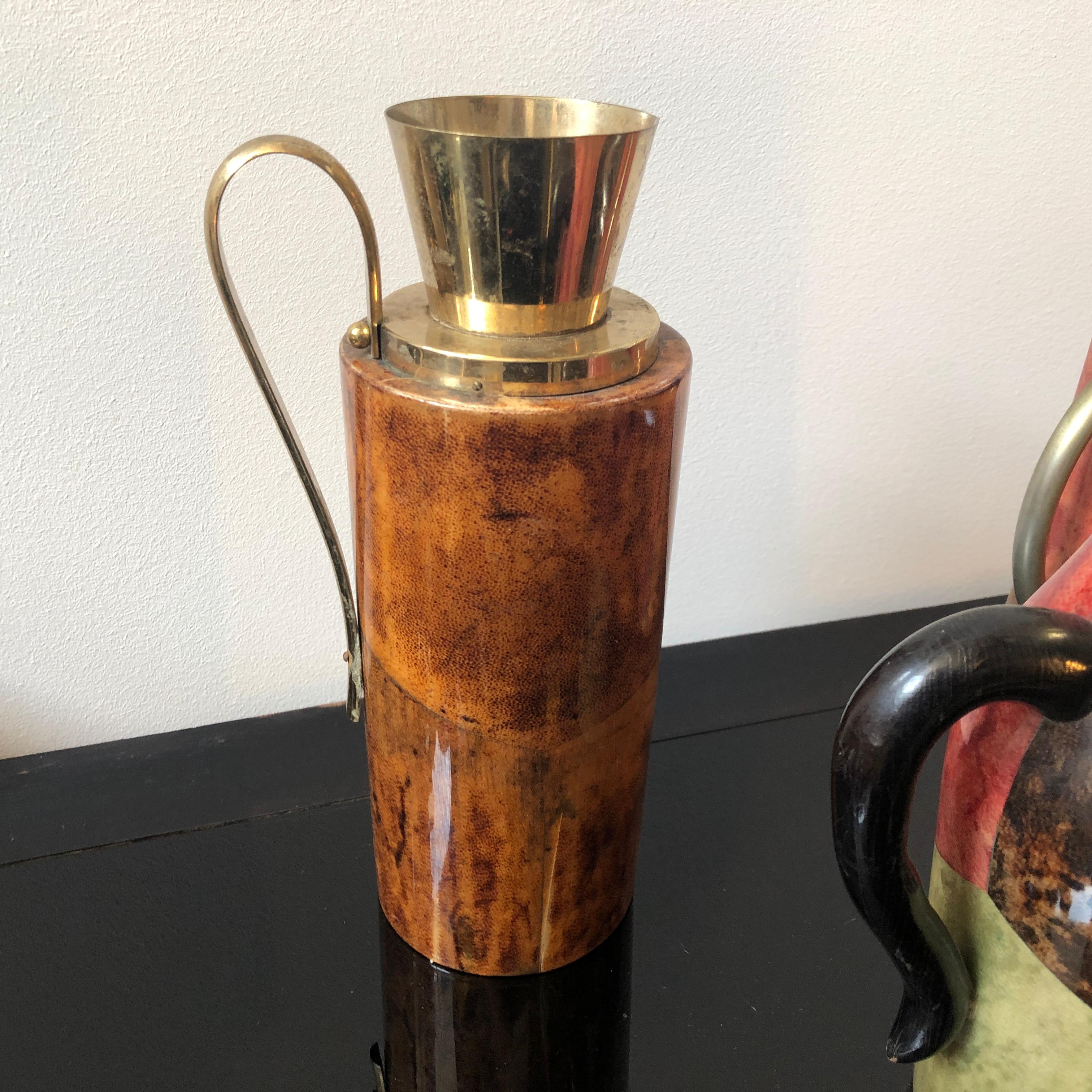 Three goatskin and brass Italian pitchers by Aldo Tura for Macabo, good conditions overall and original brass patina that create a vibrant vintage look.