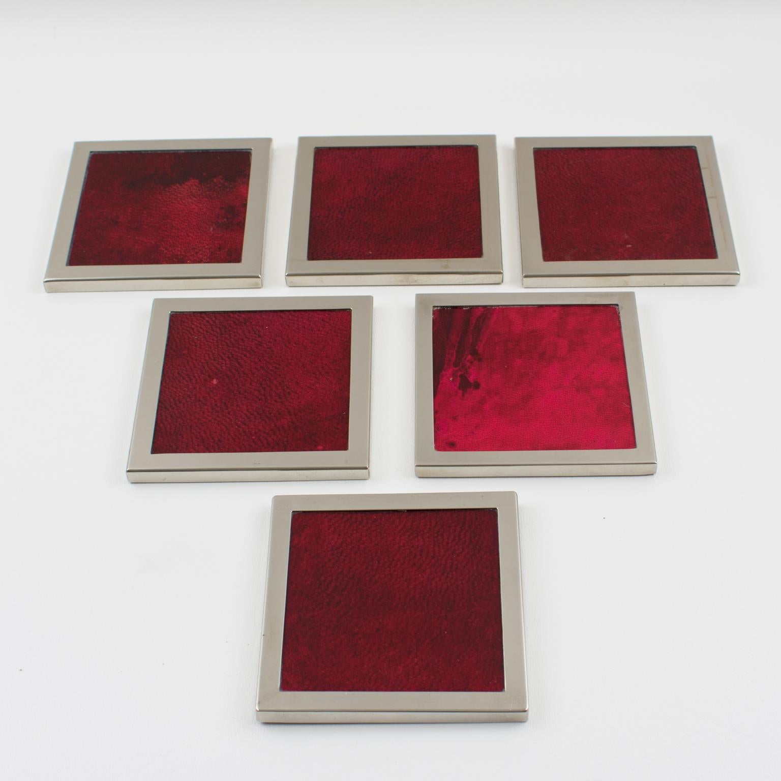 Elegant lacquered goatskin and chromed metal barware coasters, a set of 6 pieces by Italian designer Aldo Tura, Milano. A beautiful 1970s square wooden base with lacquered oxblood colored goatskin parchment veneer and chromed metal trims. Original