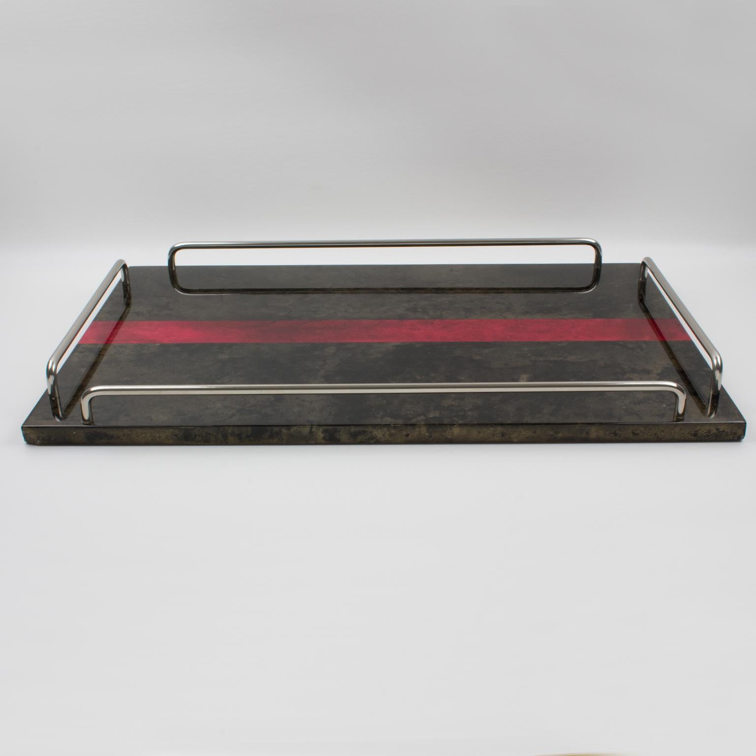 Very stylish lacquered goatskin and chromed metal barware butler tray by Italian designer Aldo Tura from the 1960s. Goatskin vellum covered rectangular serving tray in a rich brilliant brown color contrasted with an oxblood red color strip, with