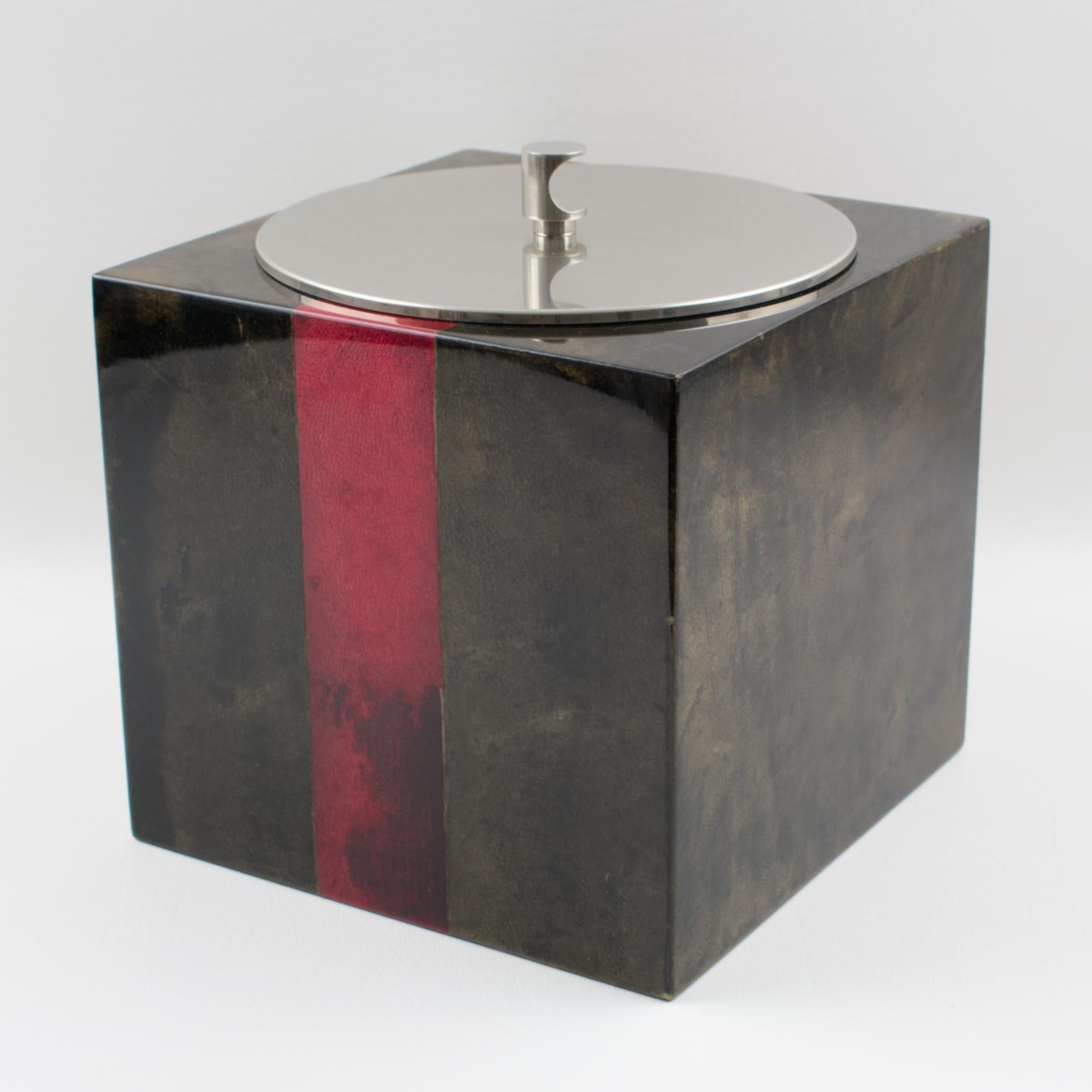 Very stylish lacquered goatskin and chromed metal ice bucket by Italian designer Aldo Tura from the 1960s. Goatskin vellum covered square ice bucket in a rich brilliant brown color contrasted with oxblood red color strips, with a chromed metal lid
