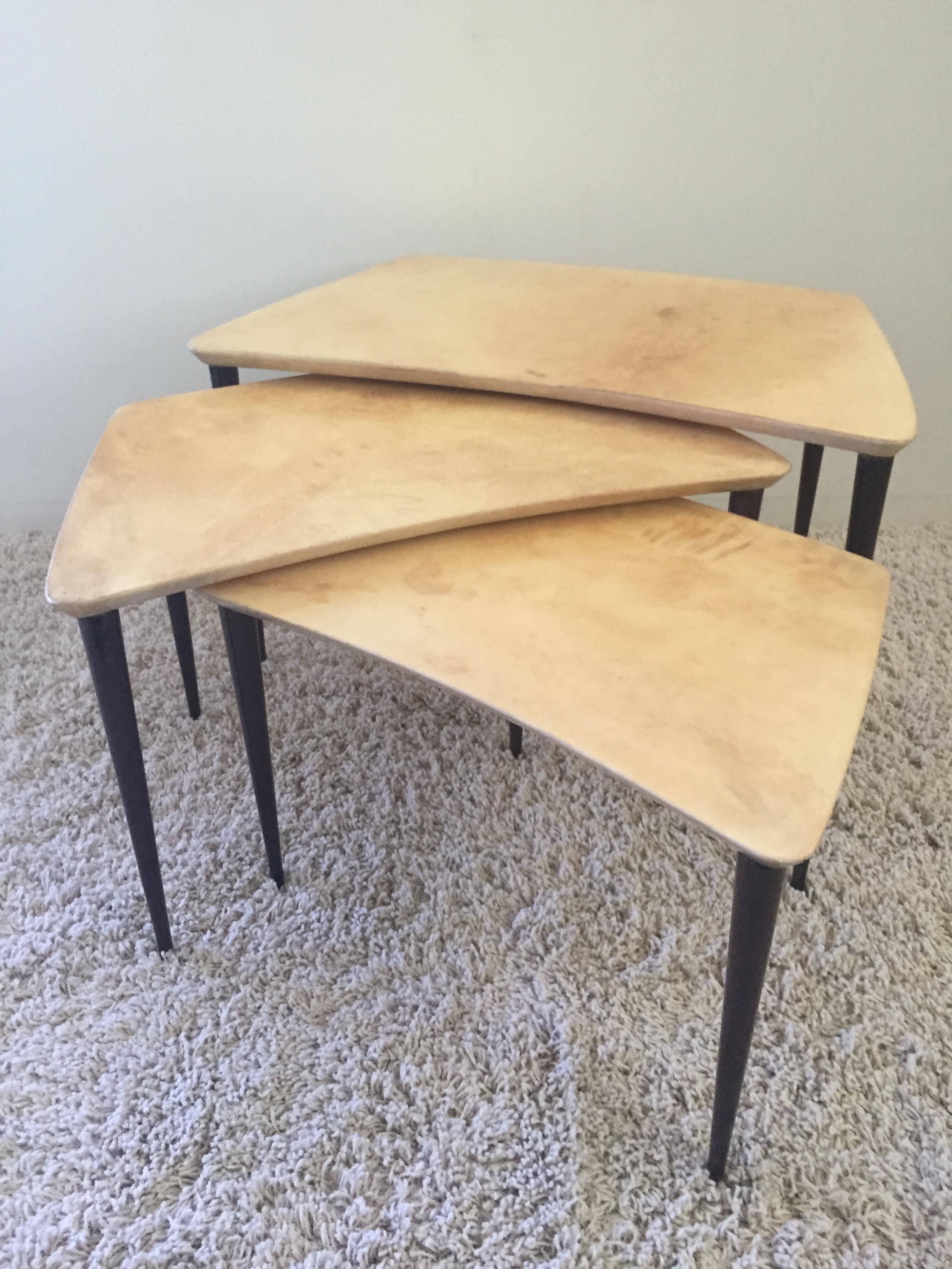 Aldo Tura goatskin tables dark legs with creme colored natural tops, set of three in three different sizes, paper label to bottom .
Sizes are 27 x 15 x1 8