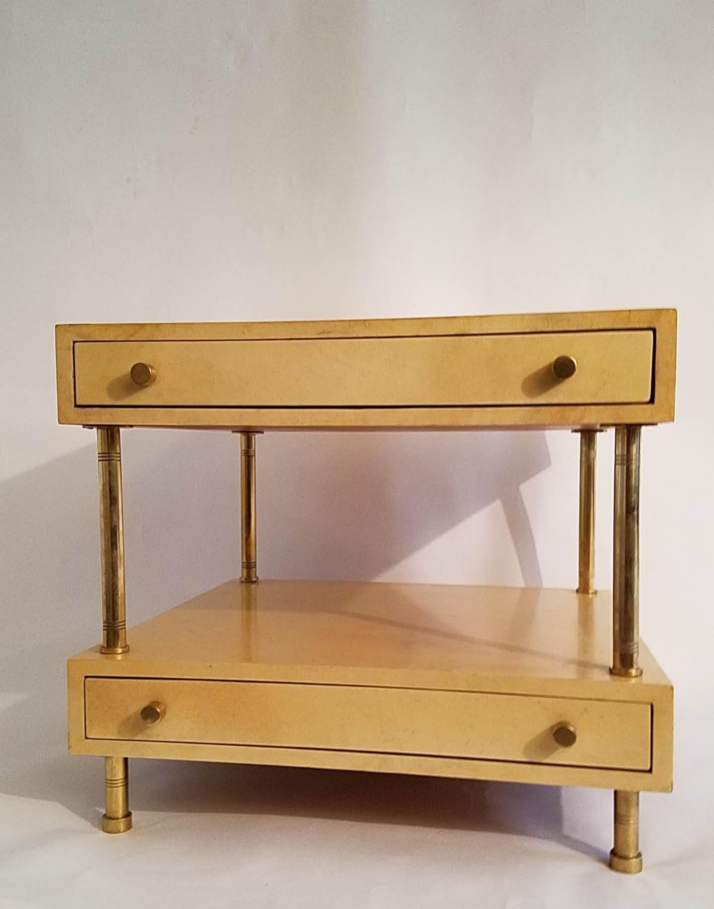 Aldo Tura 2 drawer nightstand or end table cased in parchment on polished brass legs.
Created in Milan, Italy in the 1950s.
Excellent vintage condition with wear consistent with gentle use.