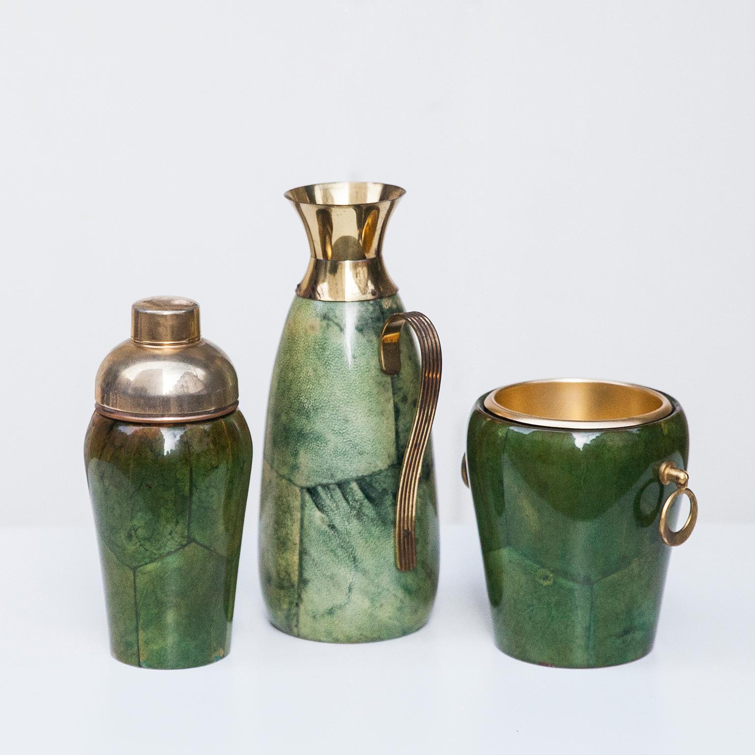 Wonderful cocktail set by Aldo Tura in green, grey parchment, ice bucket, carafe and Shaker.

 Along with artists like Piero Fornasetti and Carlo Bugatti, Aldo Tura (1909-1963) definitely belonged to the mavericks of Italian design. Where as the