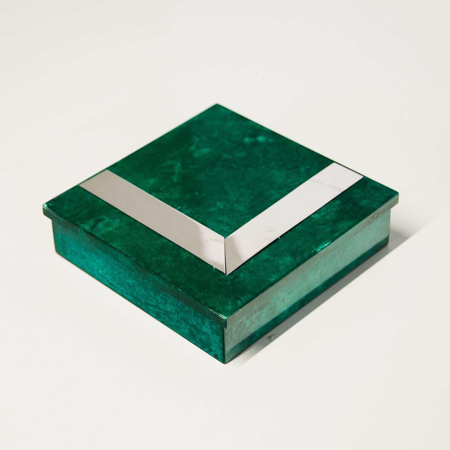 Elegant cigar box in lacquered goatskin. This box was executed, circa 1960 in light green parchment with chrome parts. Very good vintage condition.
Along with artists like Piero Fornasetti and Carlo Bugatti, Aldo Tura (1909-1963) definitely belonged