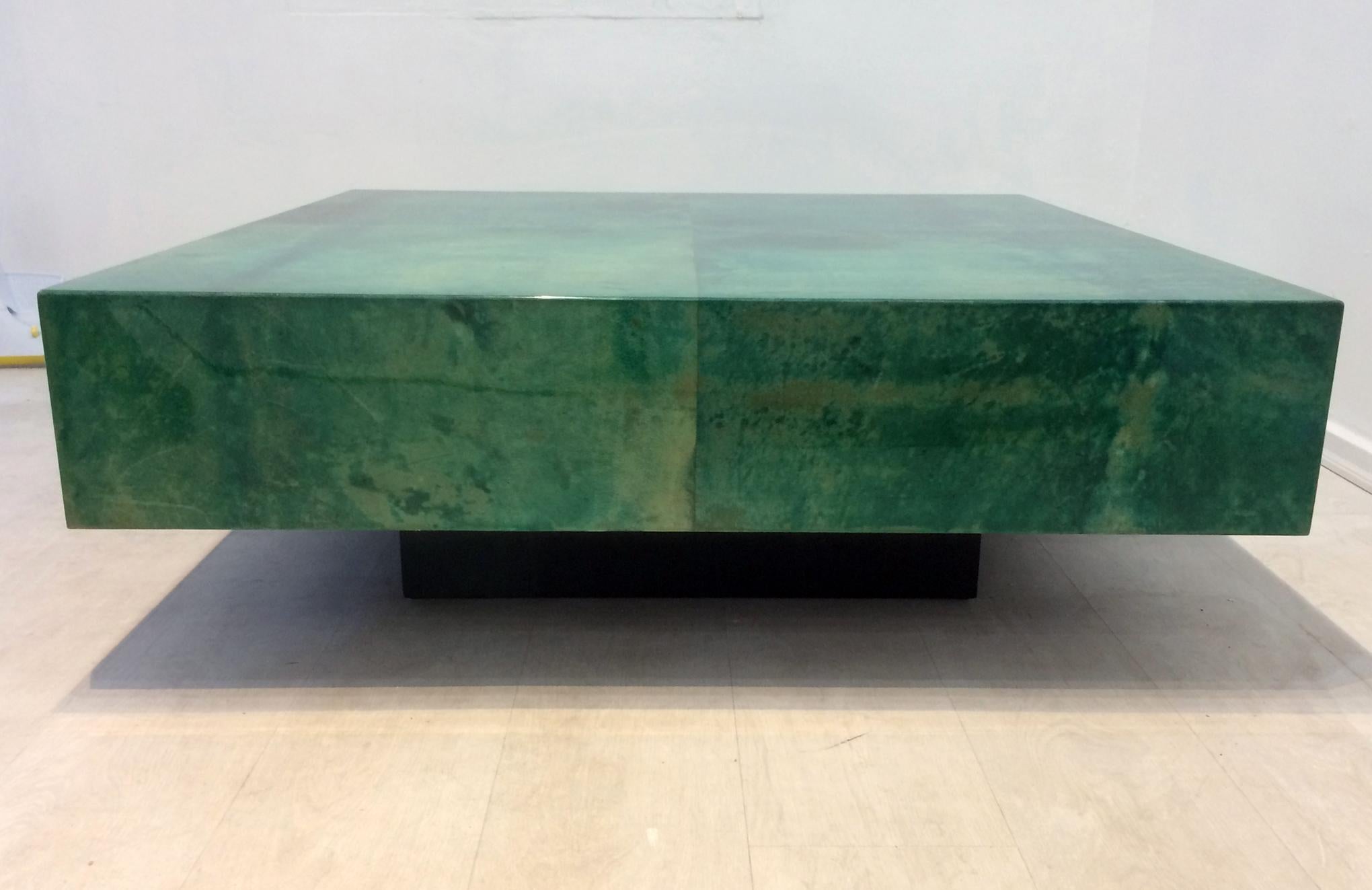 Aldo Tura square coffee table in dyed green goatskin parchment Lacquered finish in very good condition with no damage or chipping to finish or goatskin parchment. An exceptional table in excellent vintage condition.