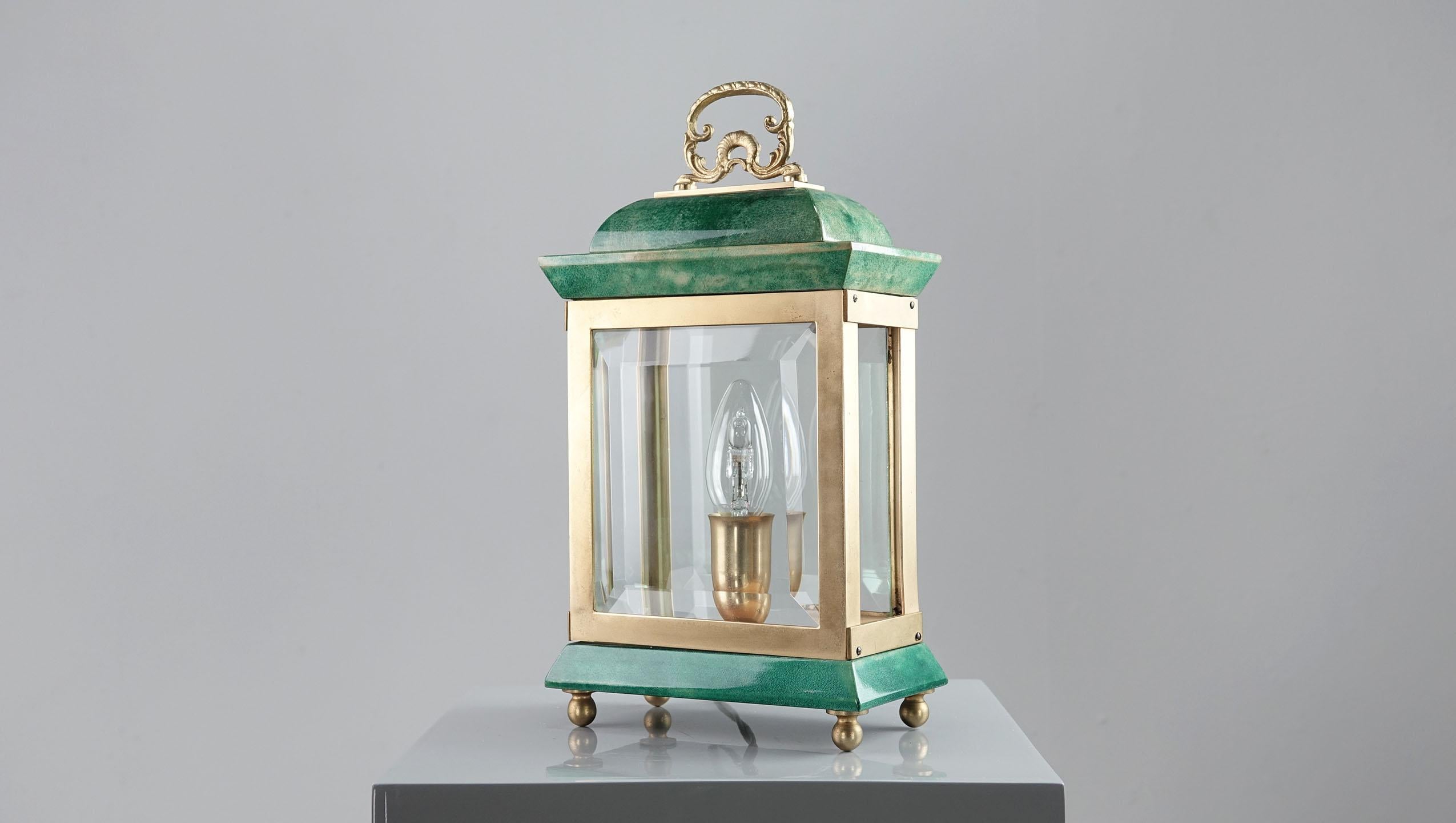 An Aldo Tura table lamp in the shape of a lantern. 
The lantern has been lovingly crafted from lacquered 
goatskin - brass & wood. Normal signs of use.
The lantern is in very good condition.