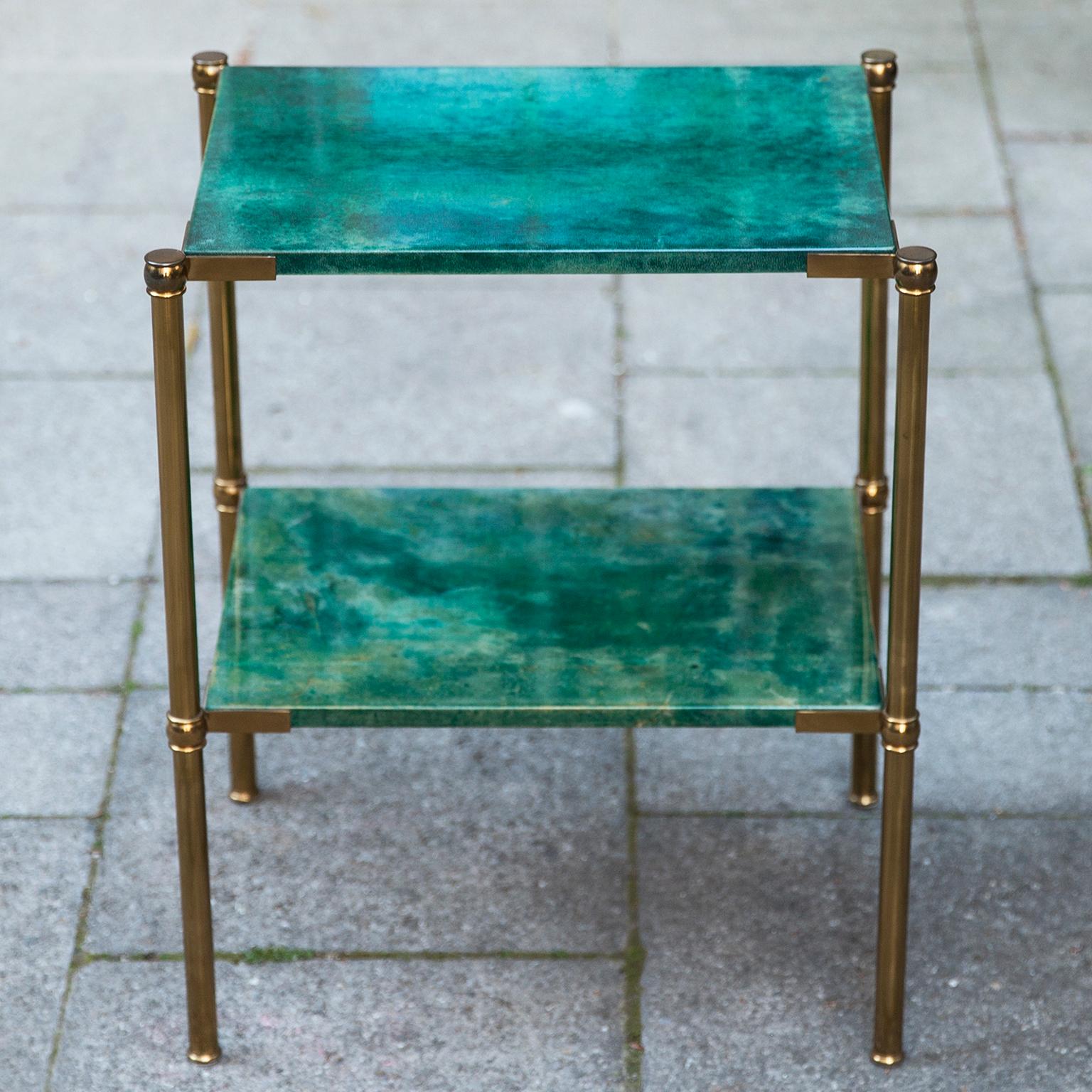 Small side table by Aldo Tura in green parchment with brass legs.

Along with artists like Piero Fornasetti and Carlo Bugatti, Aldo Tura (1909-1963) definitely belonged to the mavericks of Italian design. Where as the former chose abundant