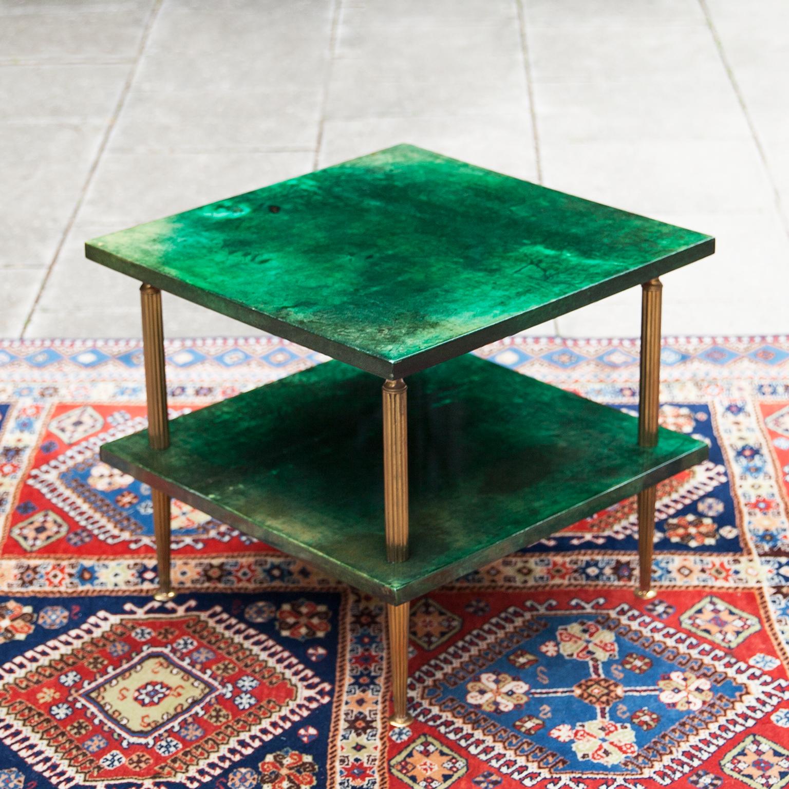 Square side table made by Aldo Tura in green lacquered goatskin and four brass ros executed circa 1970s, in excellent condition.
Along with artists like Piero Fornasetti and Carlo Bugatti, Aldo Tura (1909-1963) definitely belonged to the mavericks