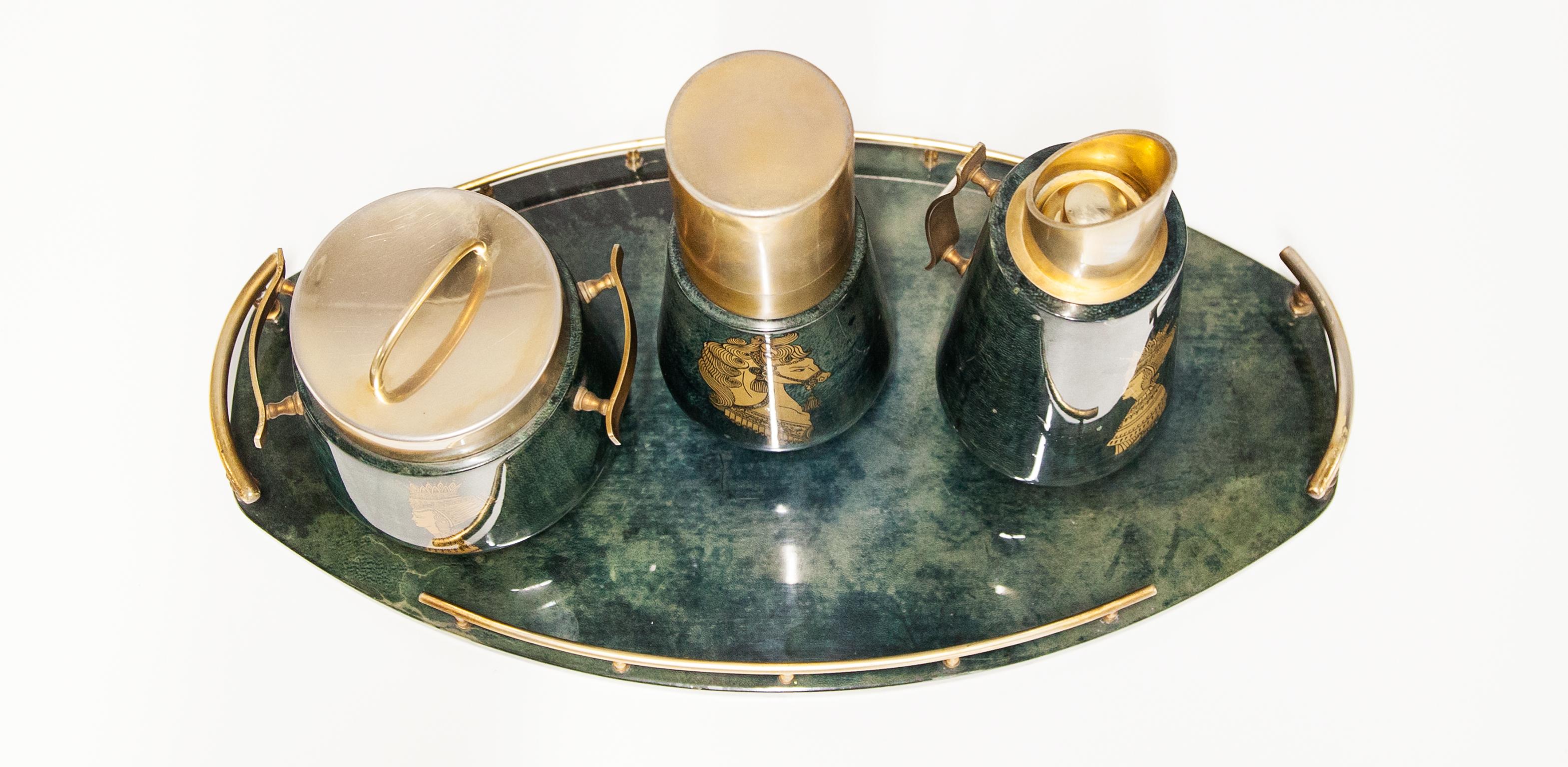 Elegant bar set made by Aldo Tura Milan, Italy 1960s.
The wooden frame is covered with green color goatskin, varnished in clear acrylic lacquer, brass and golden ornaments. This bar set was executed, circa 1960s and good vintage condition. 

31 H