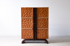 Aldo Tura hand-carved lime wood bar cabinet.