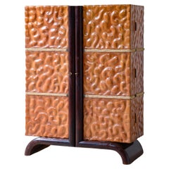 Aldo Tura hand-carved lime wood bar cabinet.