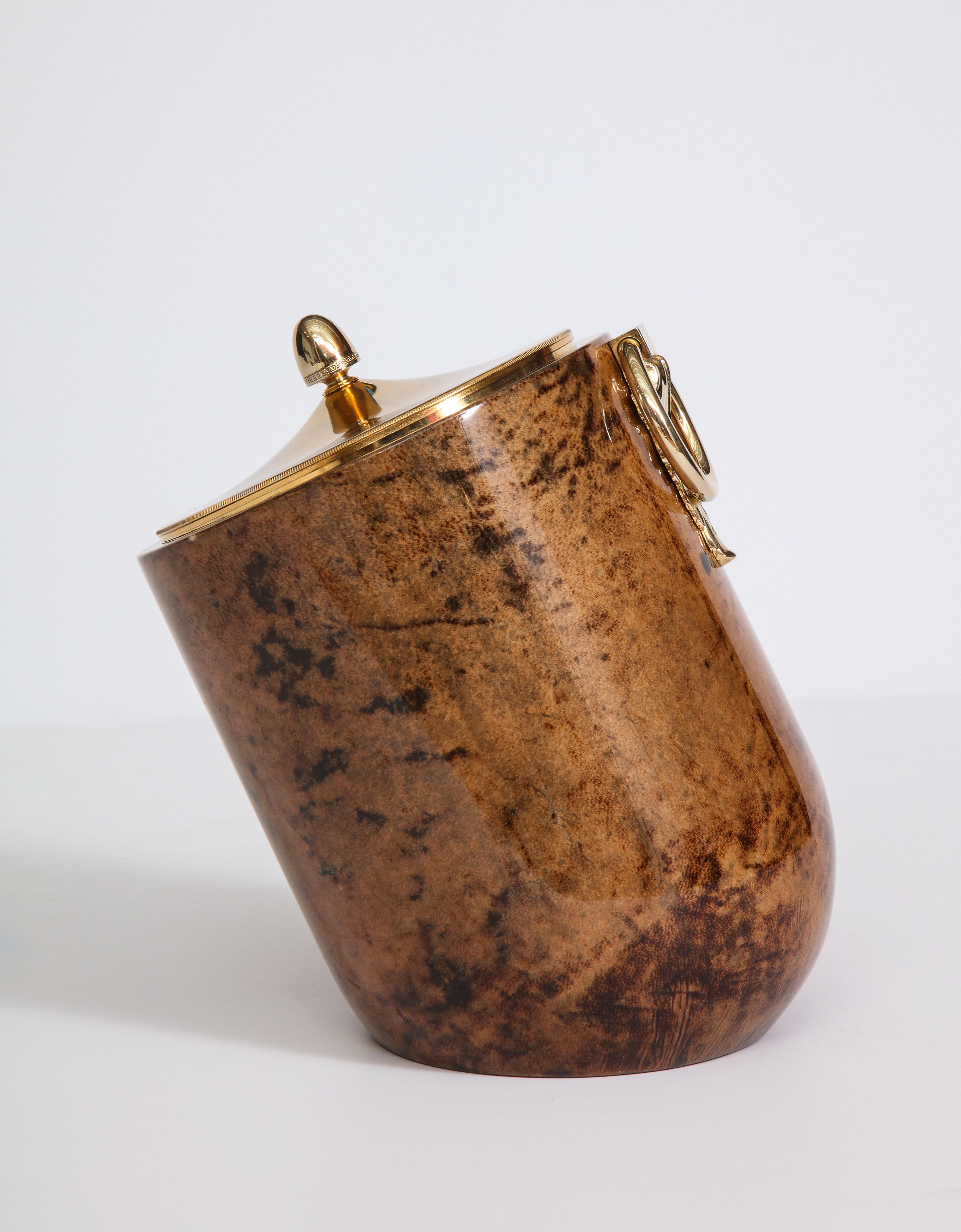 Decorative ice bucket by Aldo Tura, Italy, circa 1950. The goat skin parchment and the brass details are in very good condition. The item has been polished.