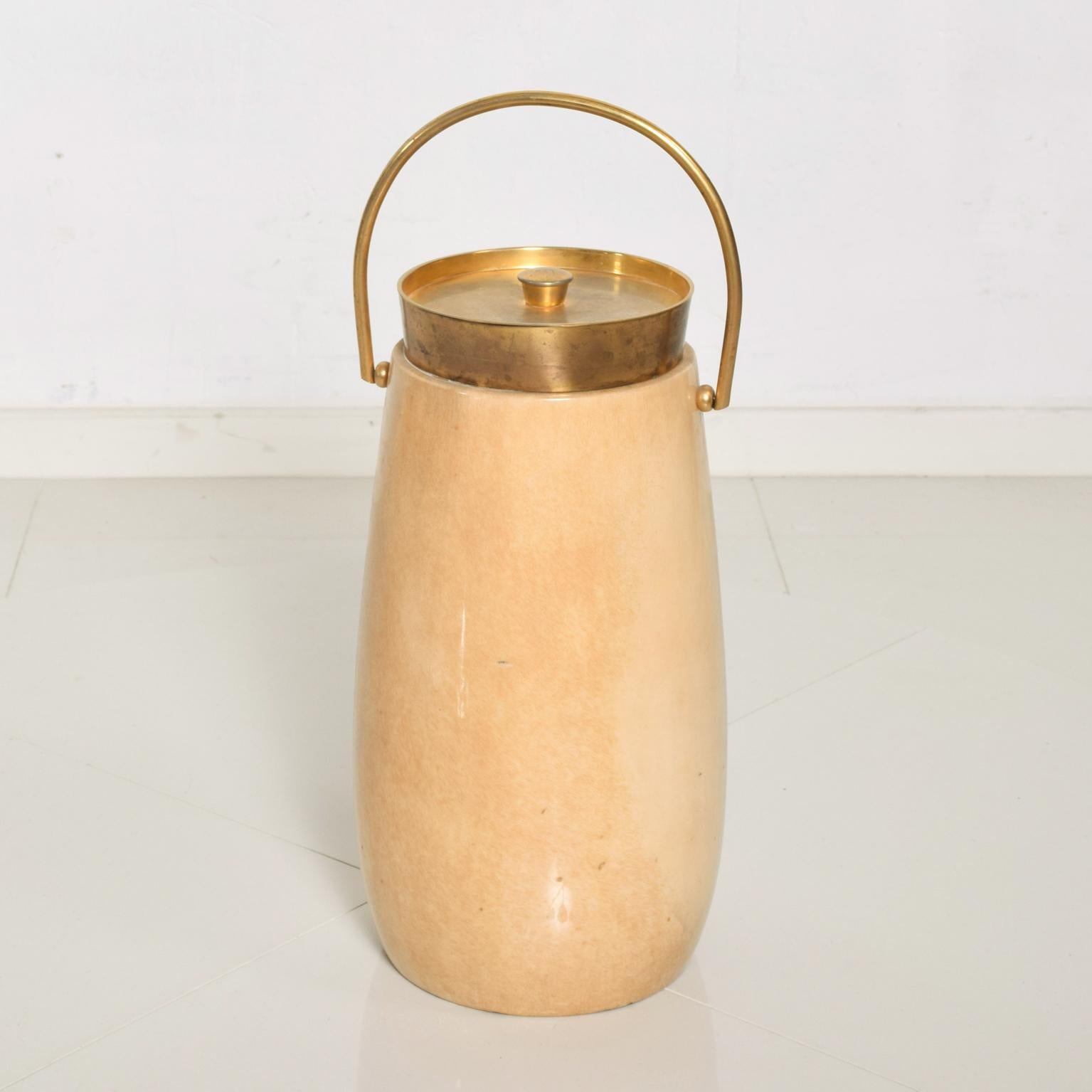 AMBIANIC is pleased to offer beautiful champagne bucket or ice bucket by Aldo Tura. 
Goatskin with original lacquer finish. 
Original brass lid. Label present from the maker. Clean modern lines. 
Made in Italy circa the 1960s. 
Dimensions: 15.5 H x