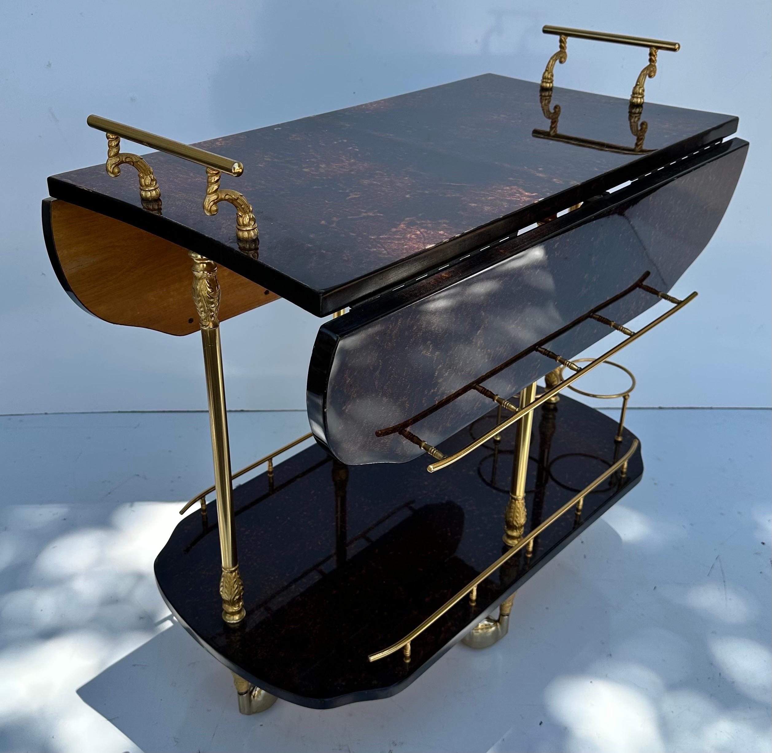 Aldo Tura goatskin and brass foldable Italian Bar Cart .
32 inches opened.
17 inches closed.