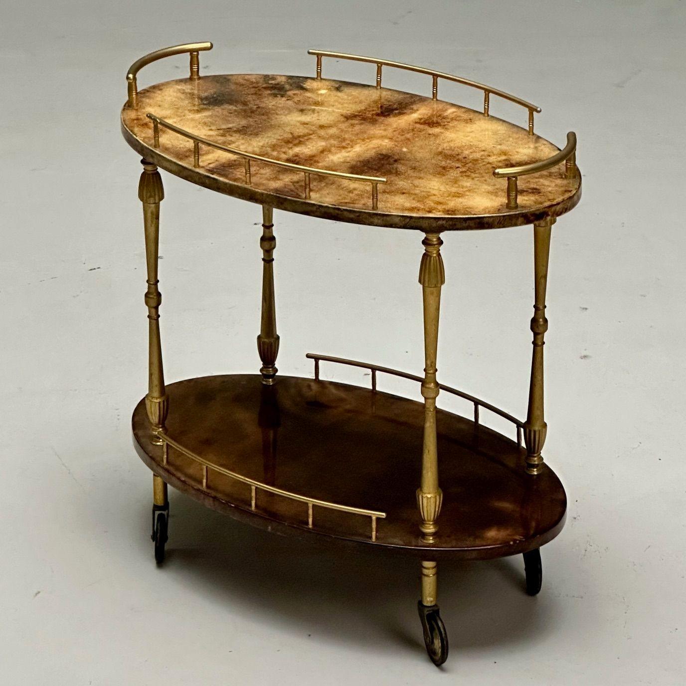 Aldo Tura, Italian Mid-Century Modern, Small Rolling Bar Cart or Serving Wagon, Goatskin, Brass, Italy 1960s

Modern serving wagon or bar cart designed by Aldo Tura and produced in Italy circa 1960s. Having two lacquered goatskin surfaces for