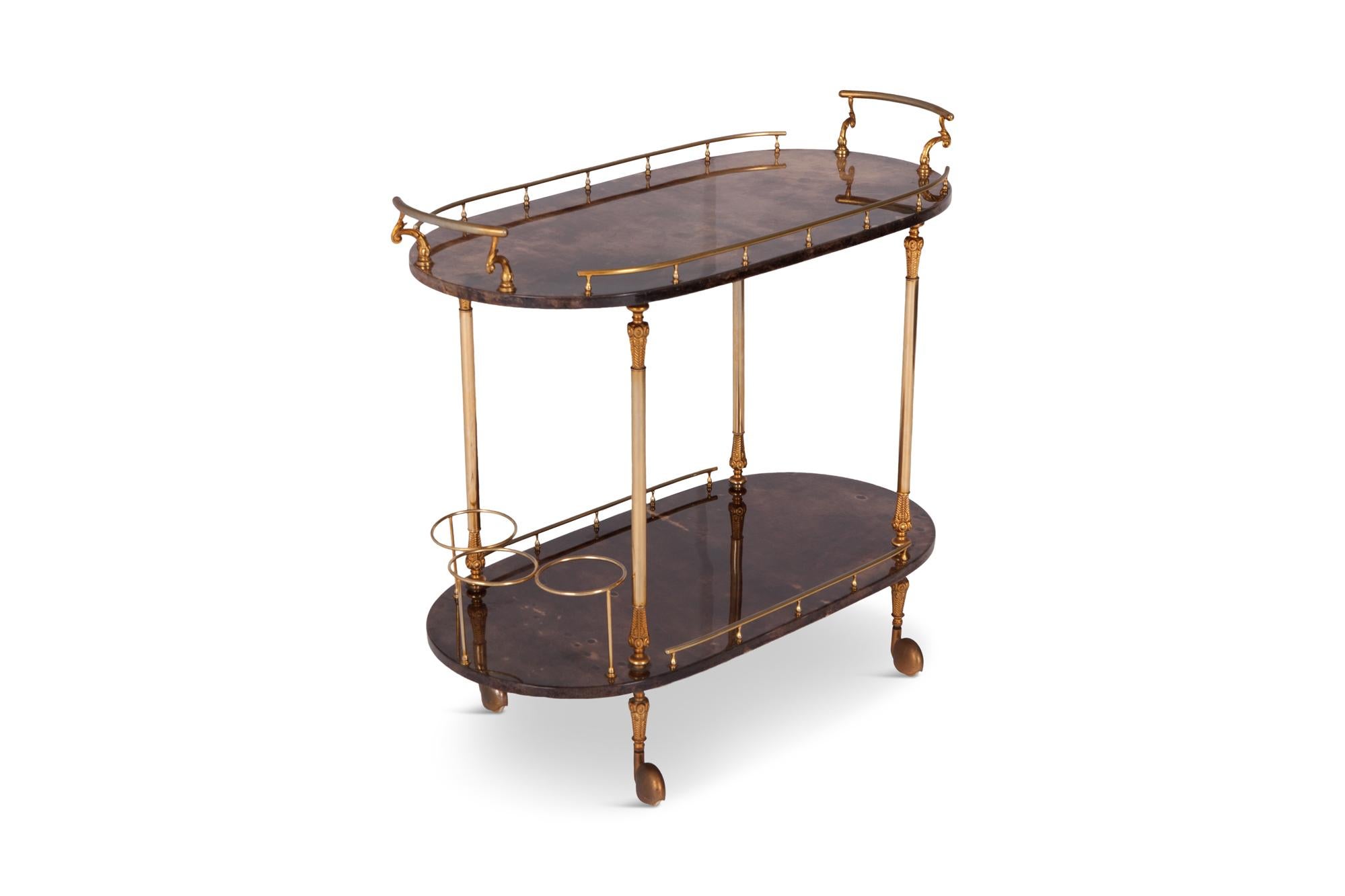 Lacquered trolley with wonderful brass detailing by Italian designer Aldo Tura.? In the manner of the master's work, a true eyecatcher. 

Italy, 1960s.

Measures: W 84, D 41, H 75 cm.