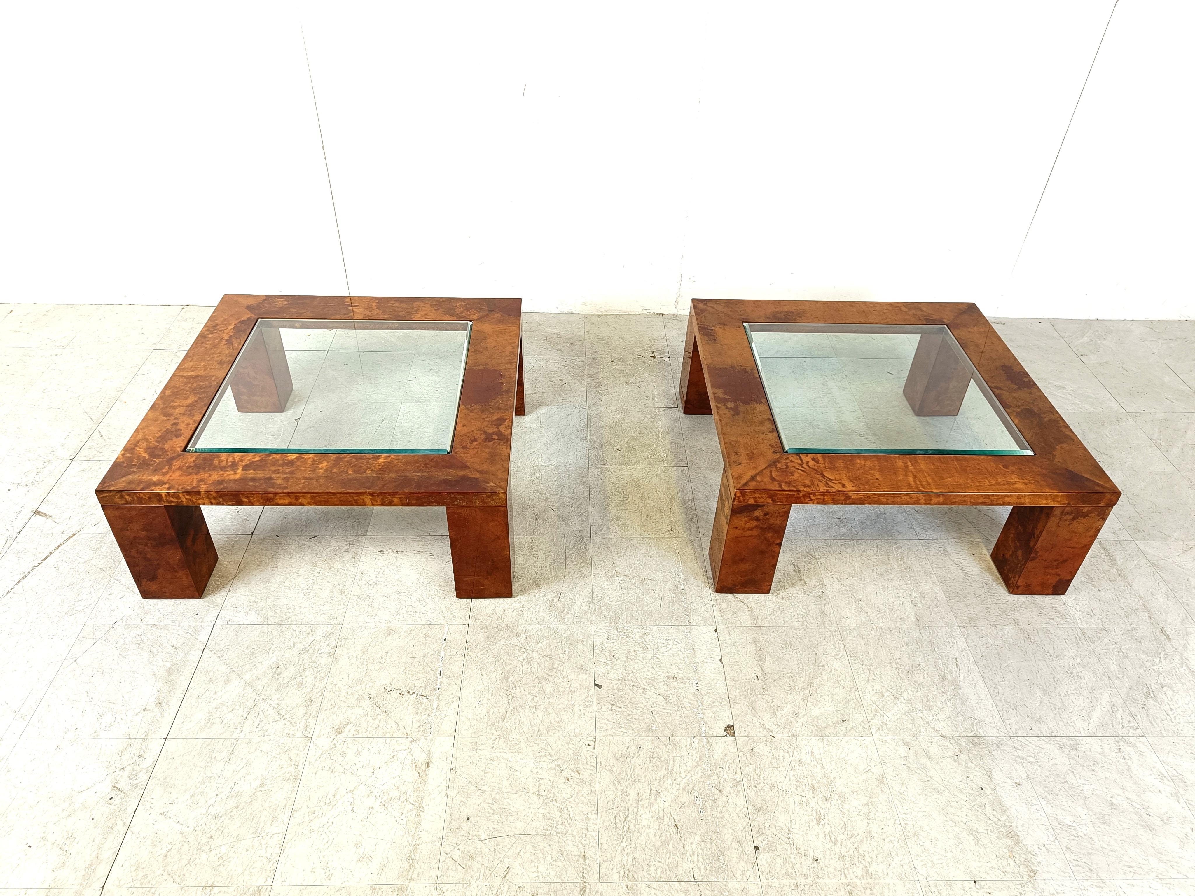 Mid century pair of lacquered goatskin coffee tables by Aldo tura.

The coffee tables each have a square beveled clear glass inlaid top.

Beautiful colour and very rare as a pair.

1960s - Italy

Dimensions:
Height: 37cm
Width depth: 90cm

Ref.:
