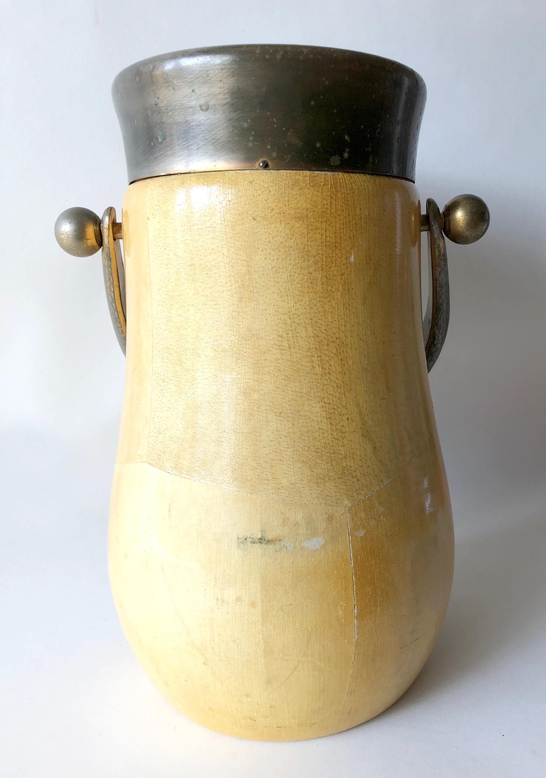 Lacquered goatskin and hand-hammered brass 
barware champagne or wine cooler designed by Aldo Tura of Italy. Piece measures 14.5