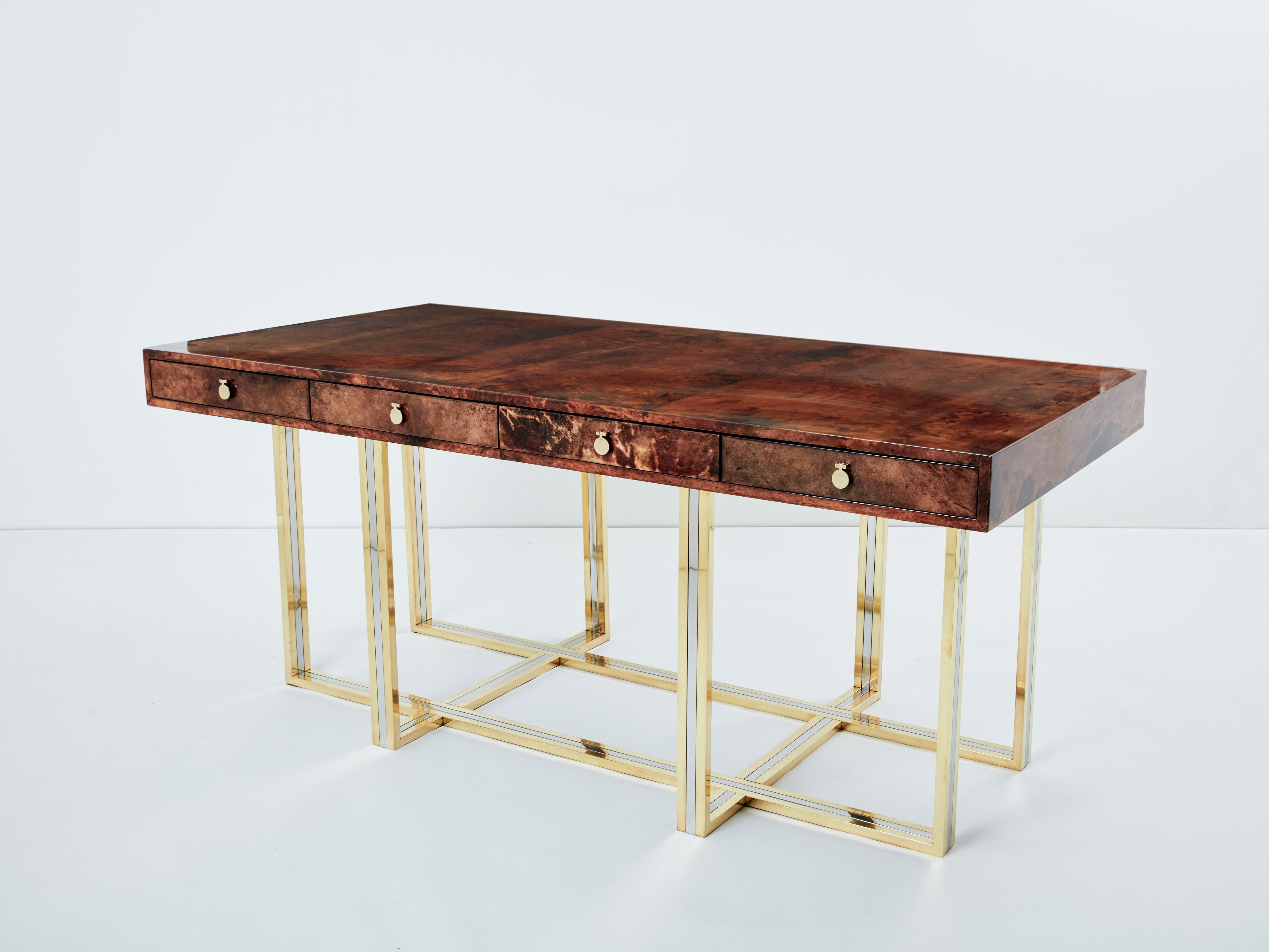 This unique Aldo Tura desk was produced in Italy in the late 1960s, and really feels imposing and glamorous. The varnished goatskin parchment, in rich shades of brown and dark brown, makes this desk typical of designer Aldo Tura signature. It